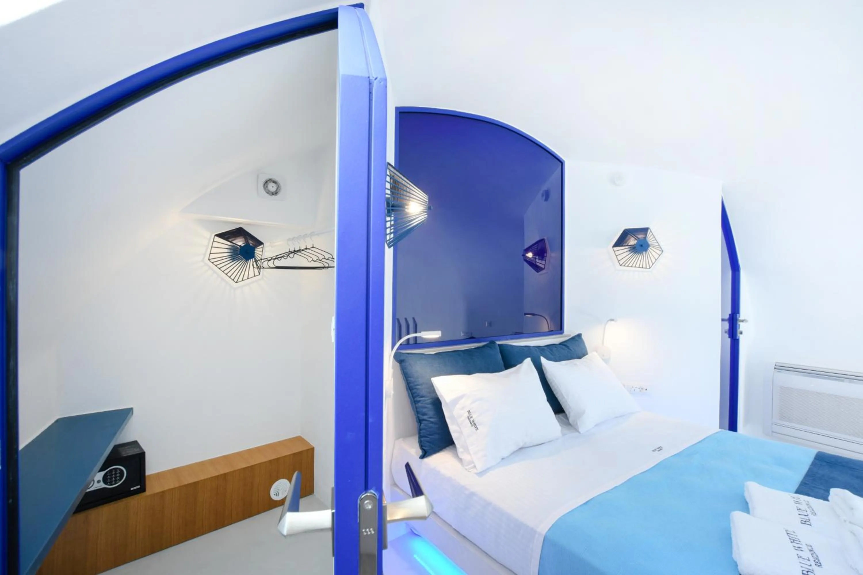 Bed in Blue White Residence