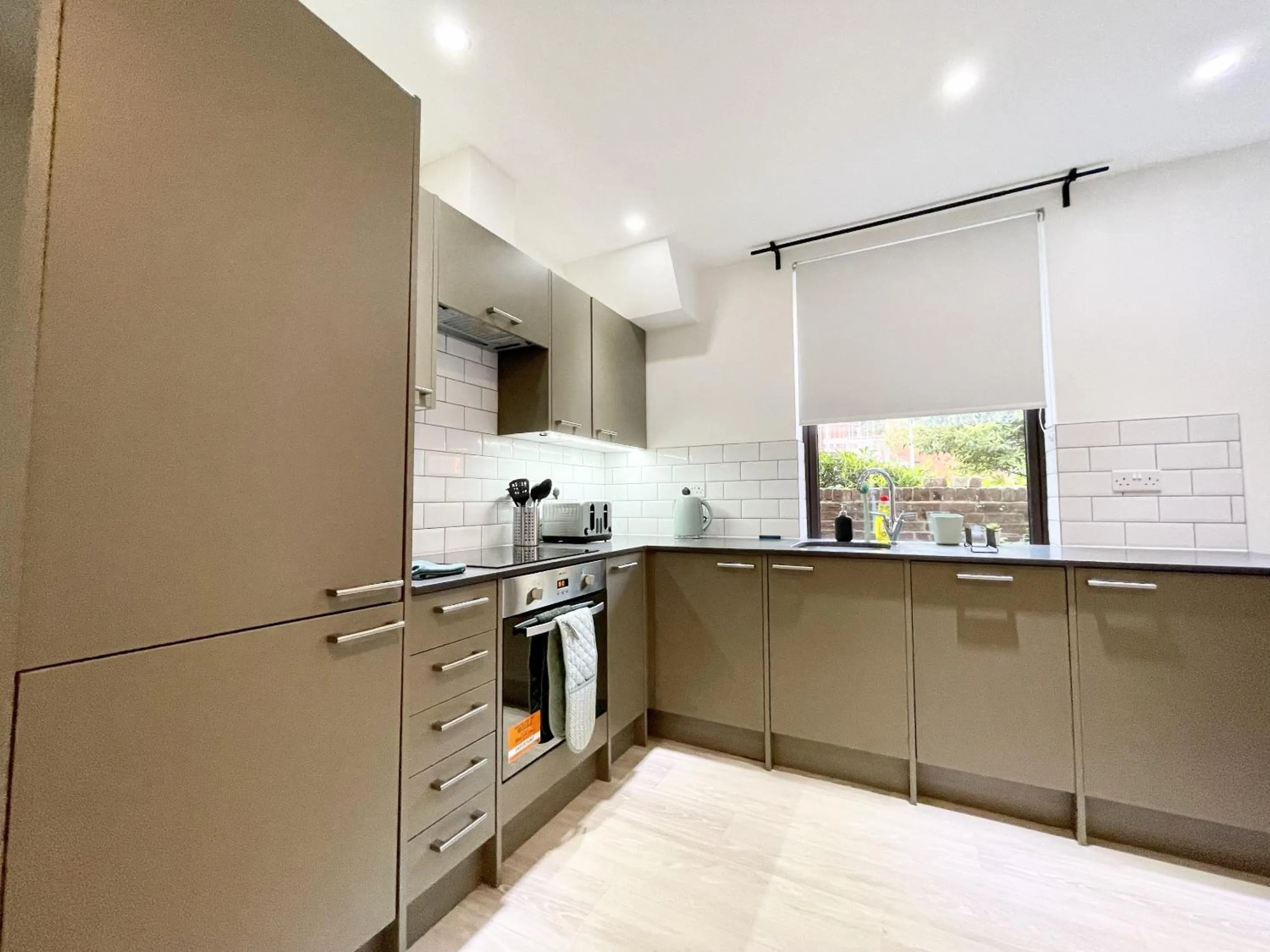Kitchen or kitchenette in Southernhay Court Apartments by Staytor Accommodation