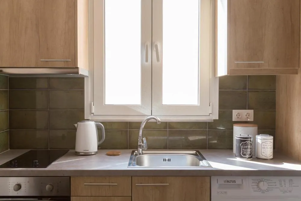 Kitchen or kitchenette in Anemi Green Cozy apartment, beach views and comfort!