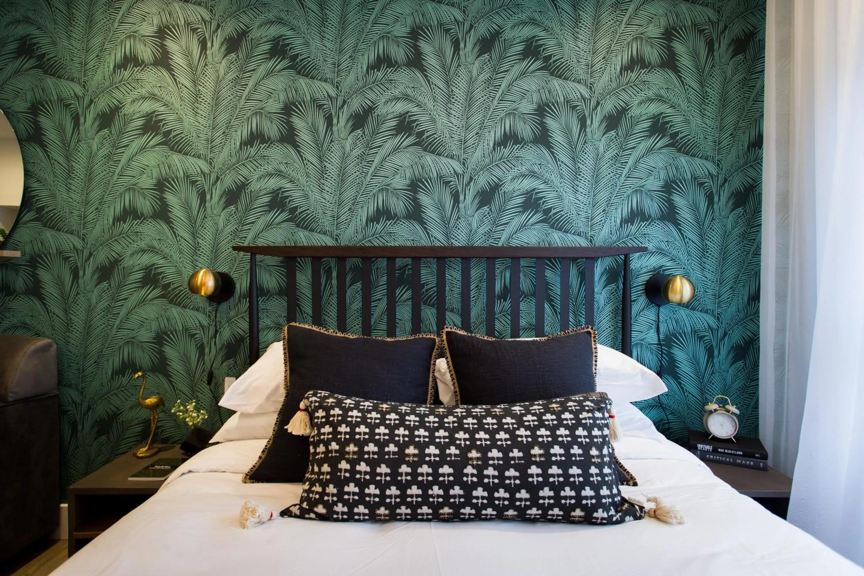 Bed in Blue Tropics Studio in Little Italy with kitchen by Den Stays