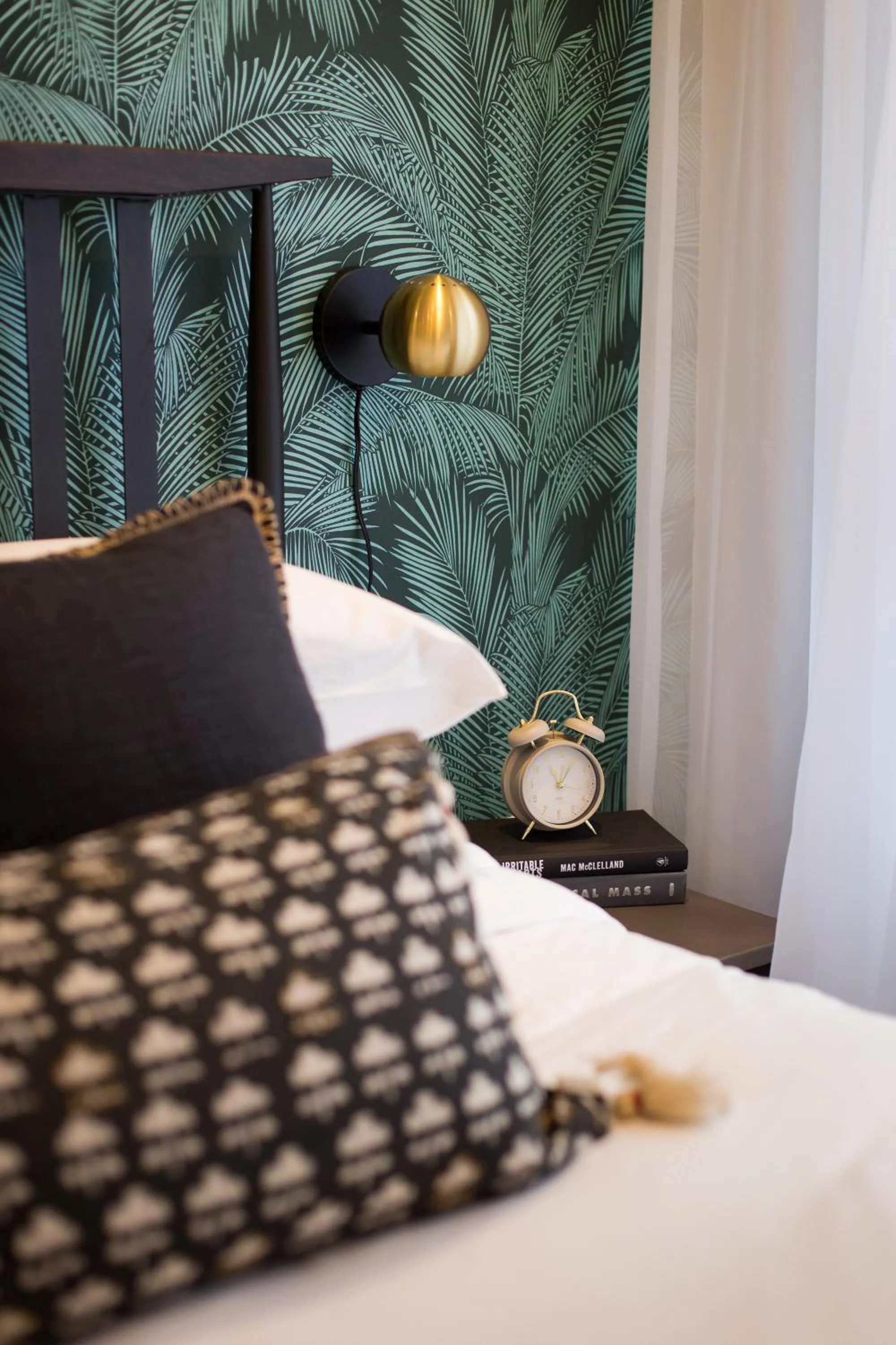 Bed in Blue Tropics Studio in Little Italy with kitchen by Den Stays