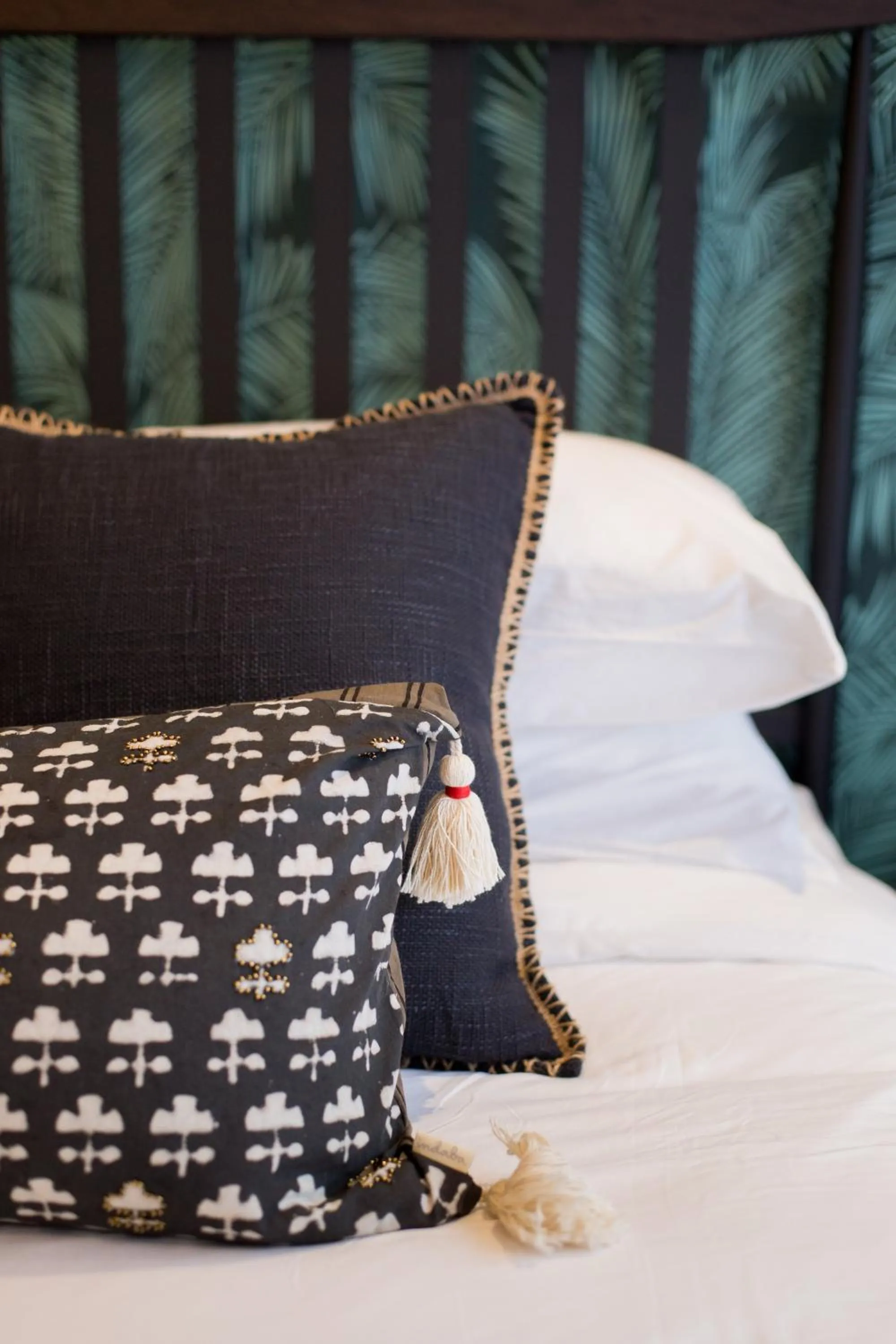 Bed in Blue Tropics Studio in Little Italy with kitchen by Den Stays