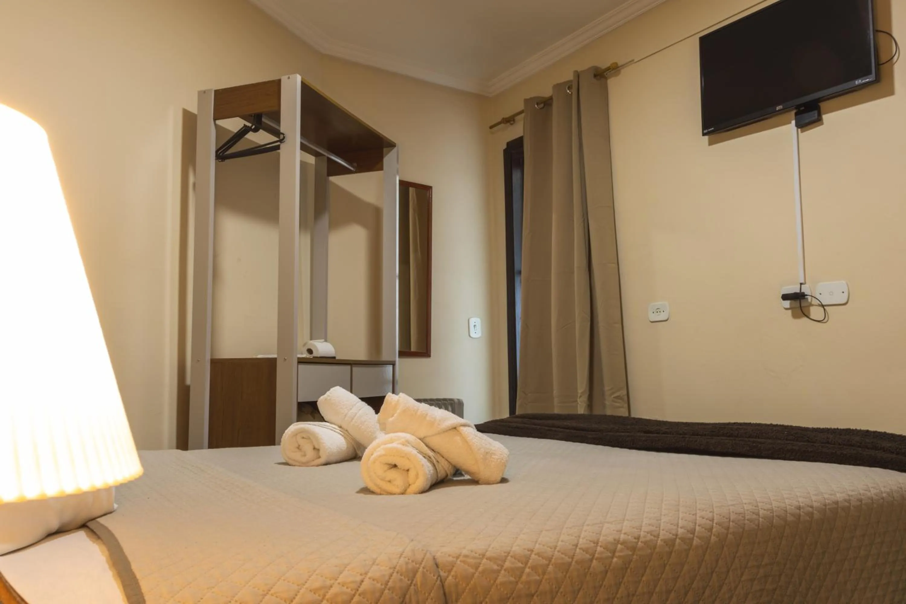 Bed in Pousada Araucária