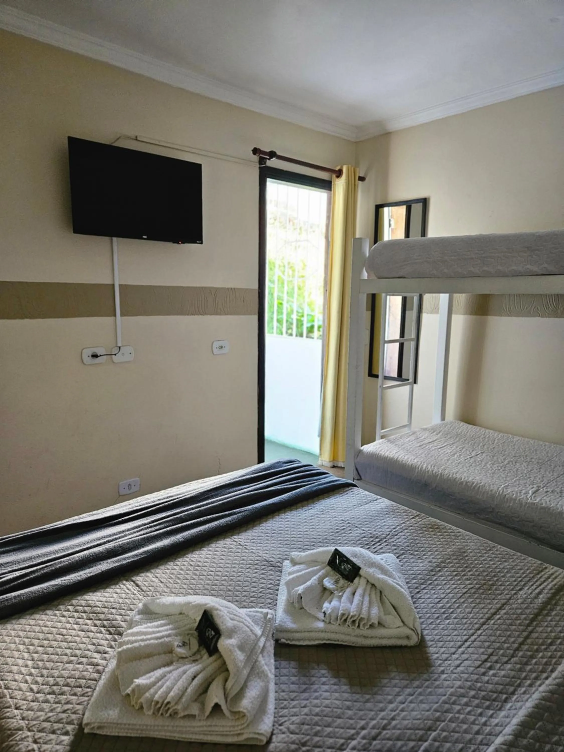 Bed in Pousada Araucária