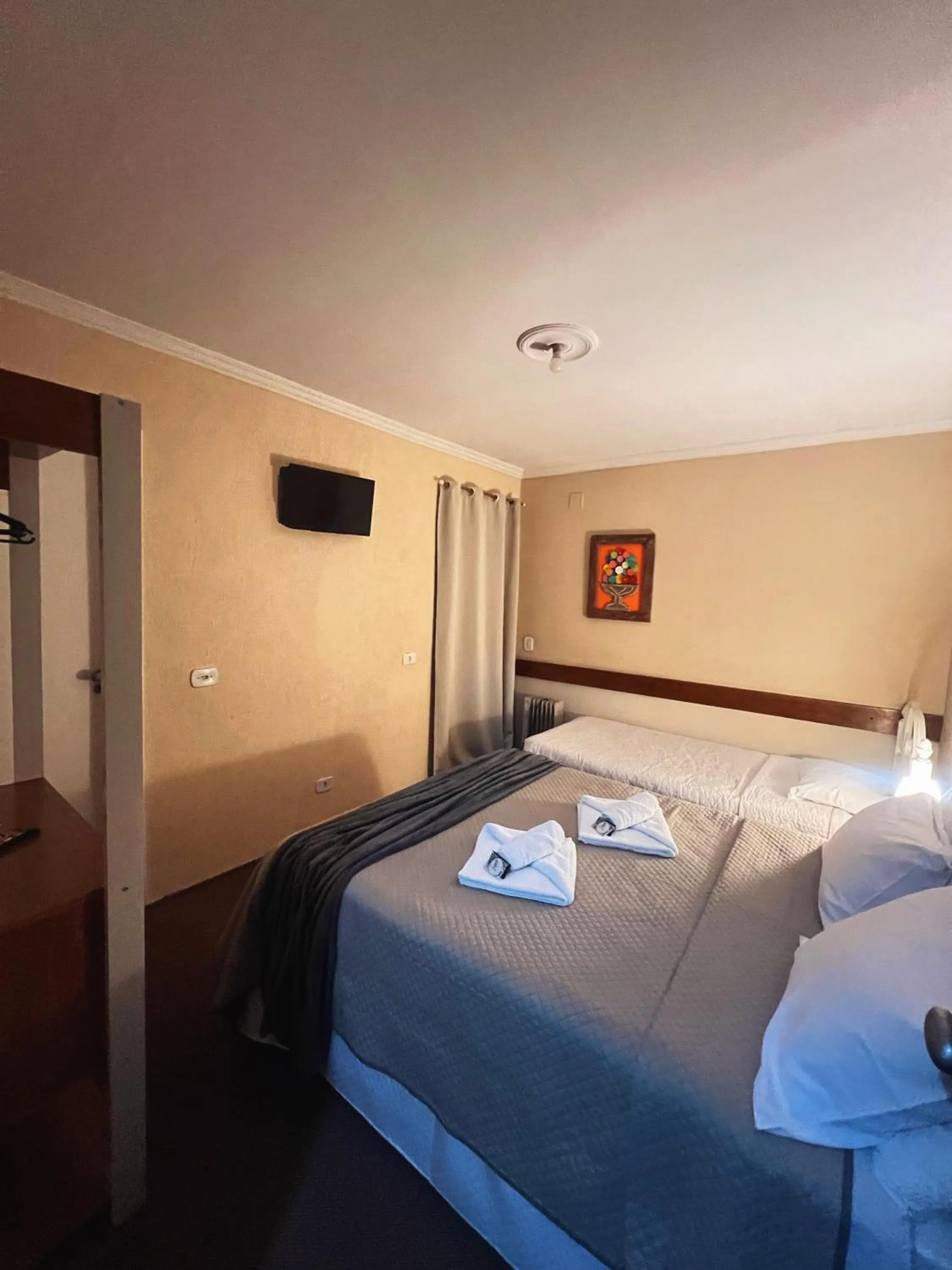 Bed in Pousada Araucária