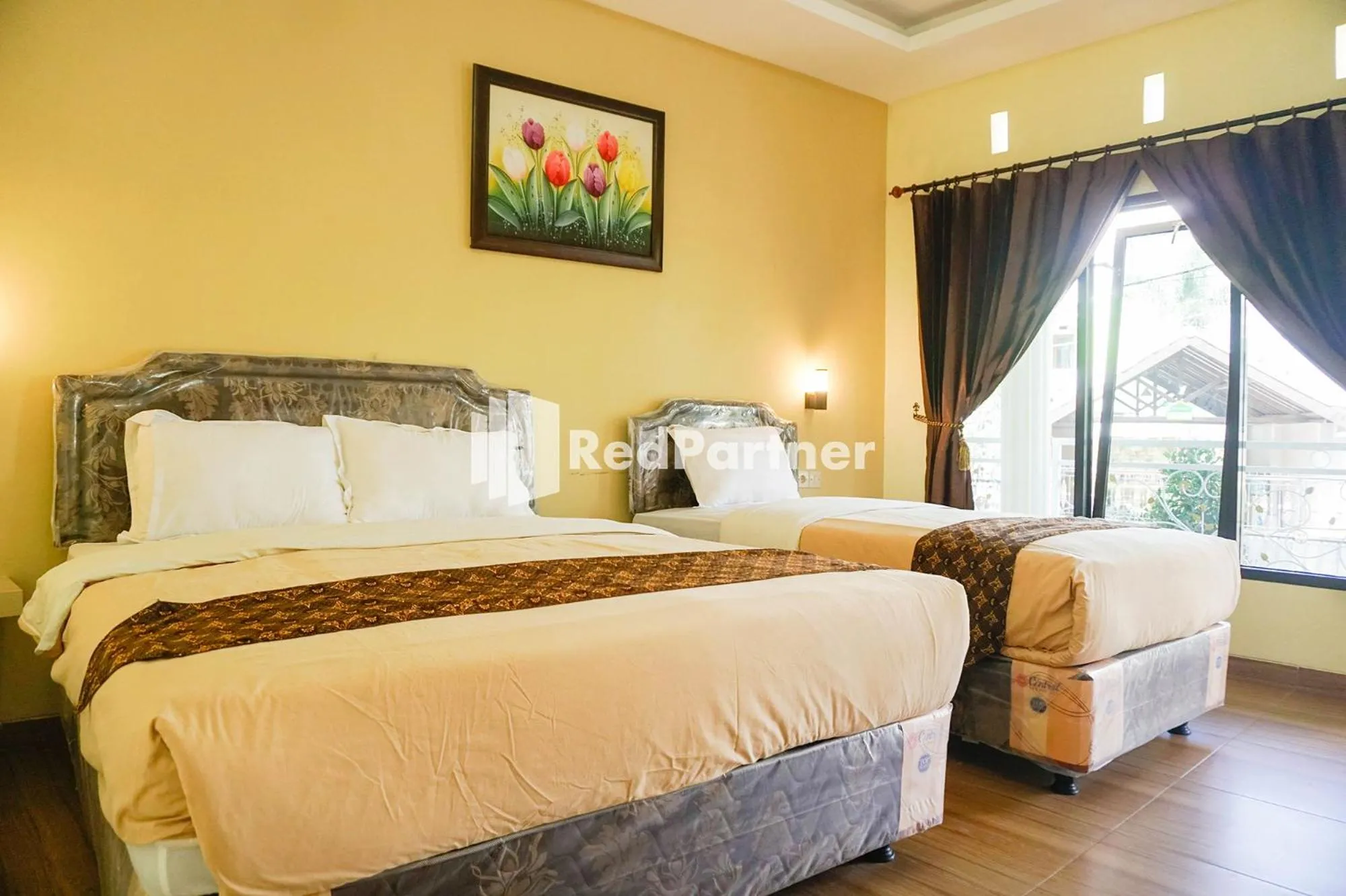 Bed in Griya Imafa Inn RedPartner near Jatim Park 2