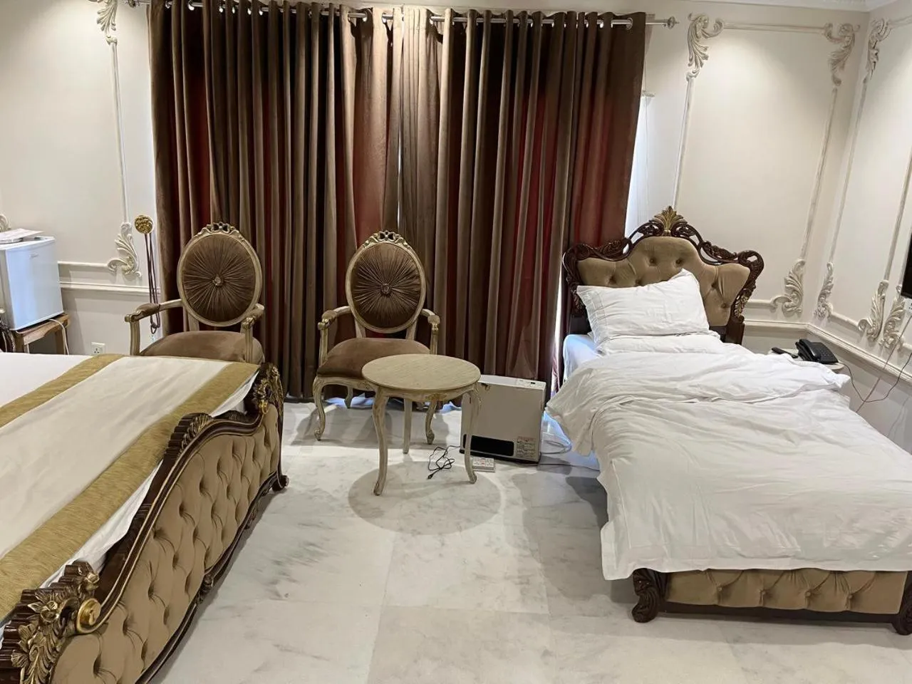 Bed in Arish Luxury Suites
