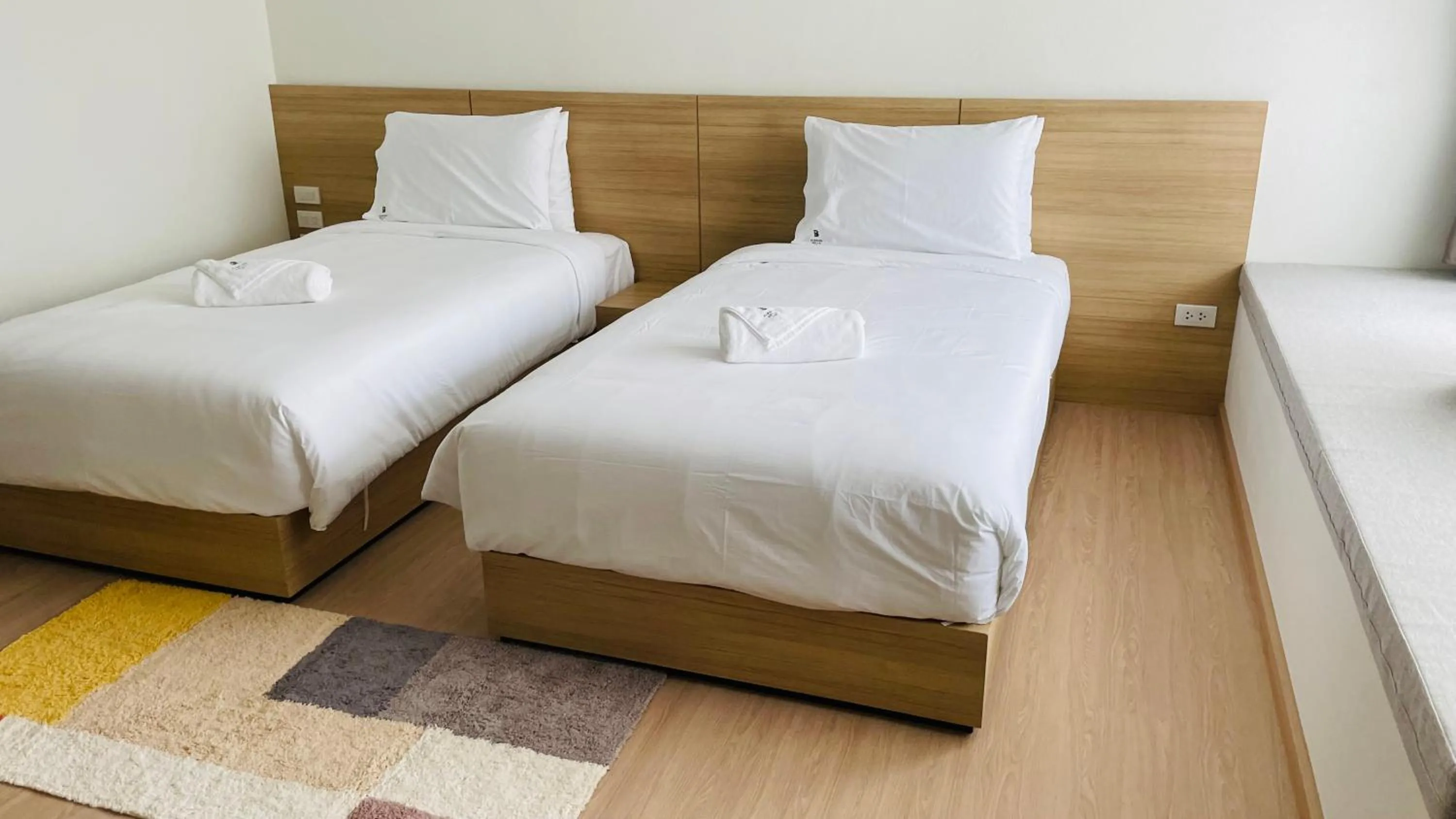 Bed in Busaba Bella Hotel