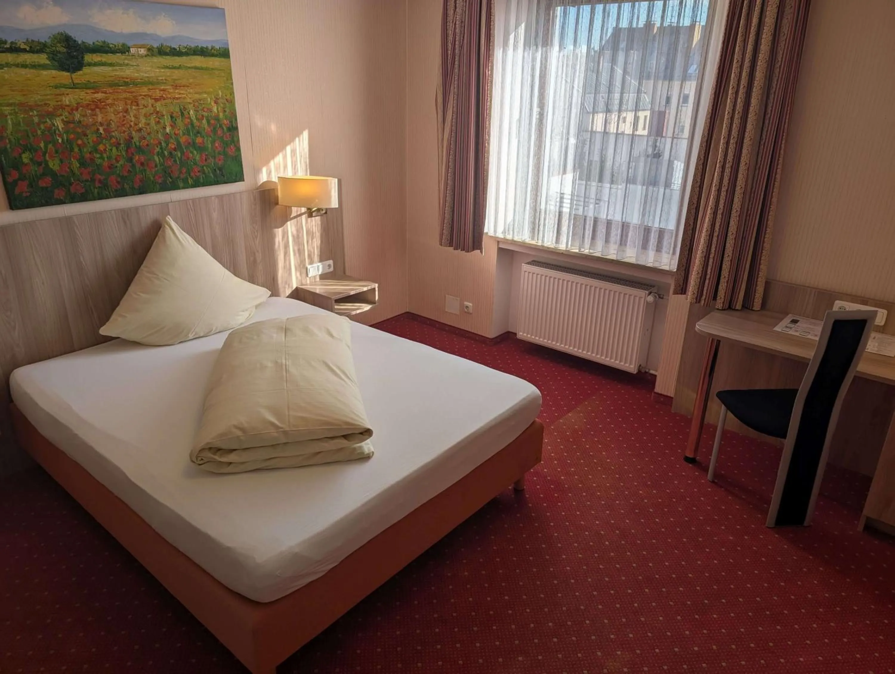 Bed in Stadthotel Augsburg