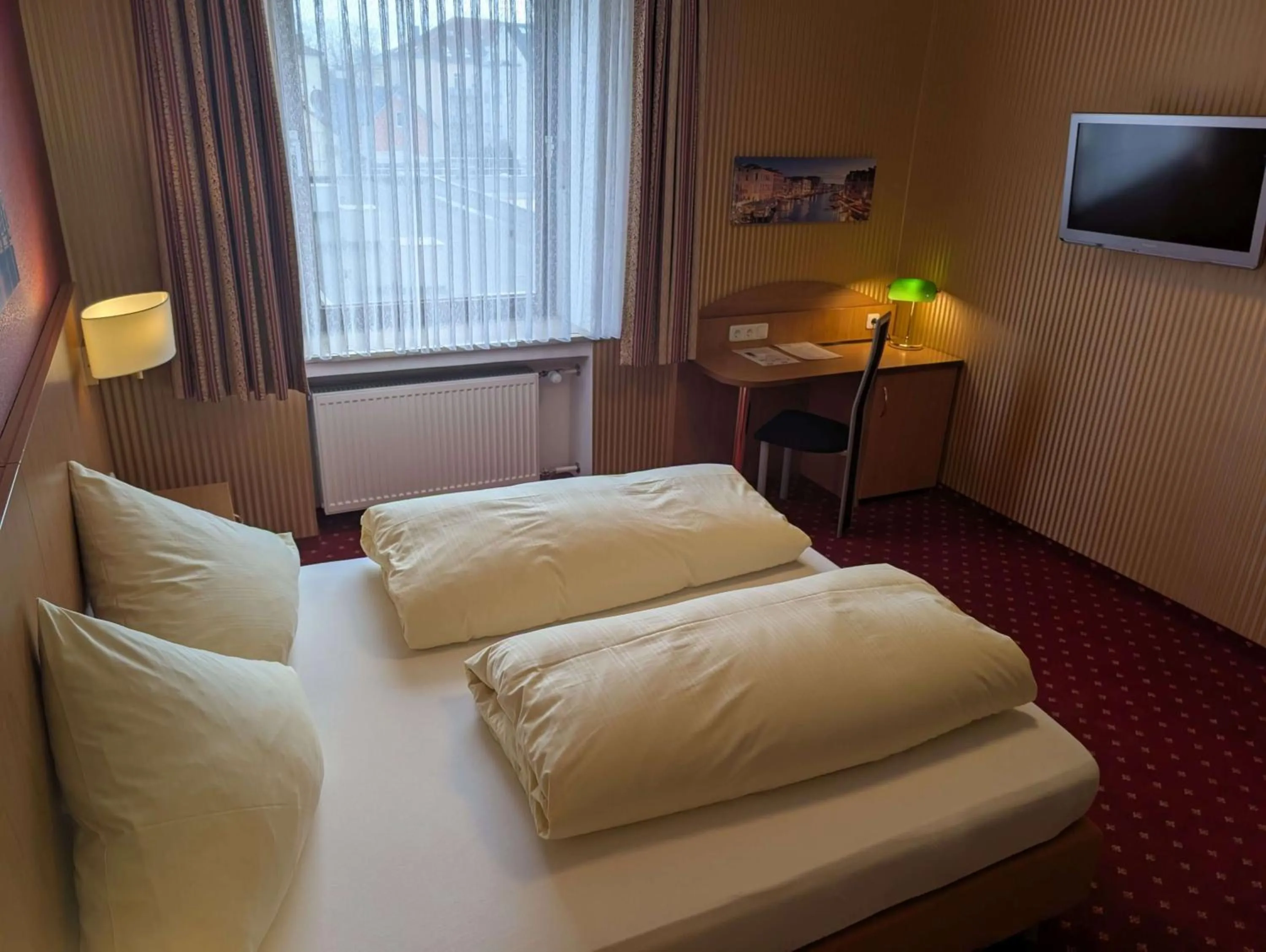 Bed in Stadthotel Augsburg