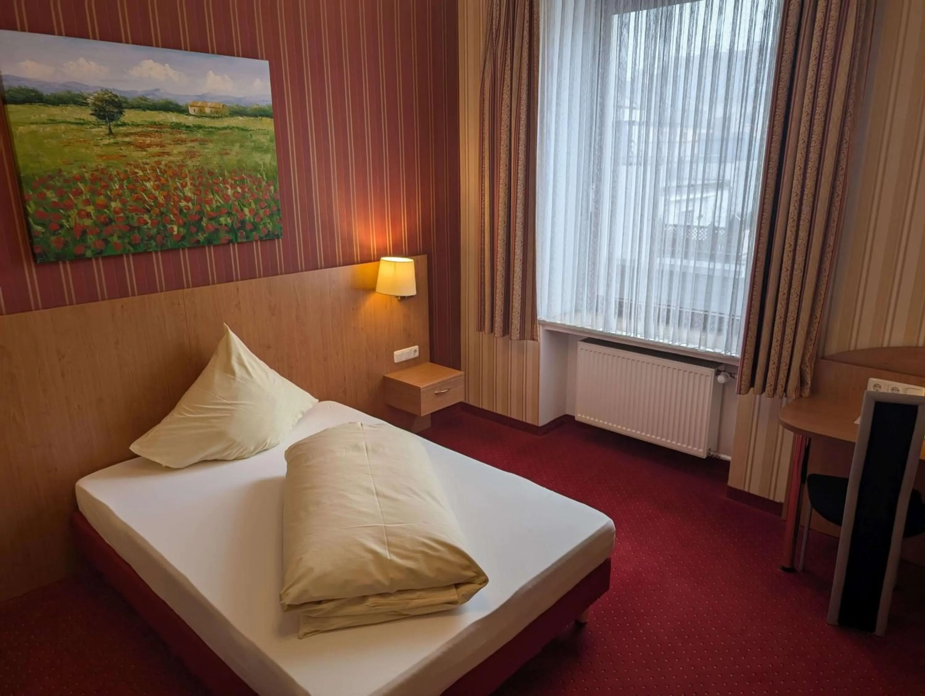 Bed in Stadthotel Augsburg
