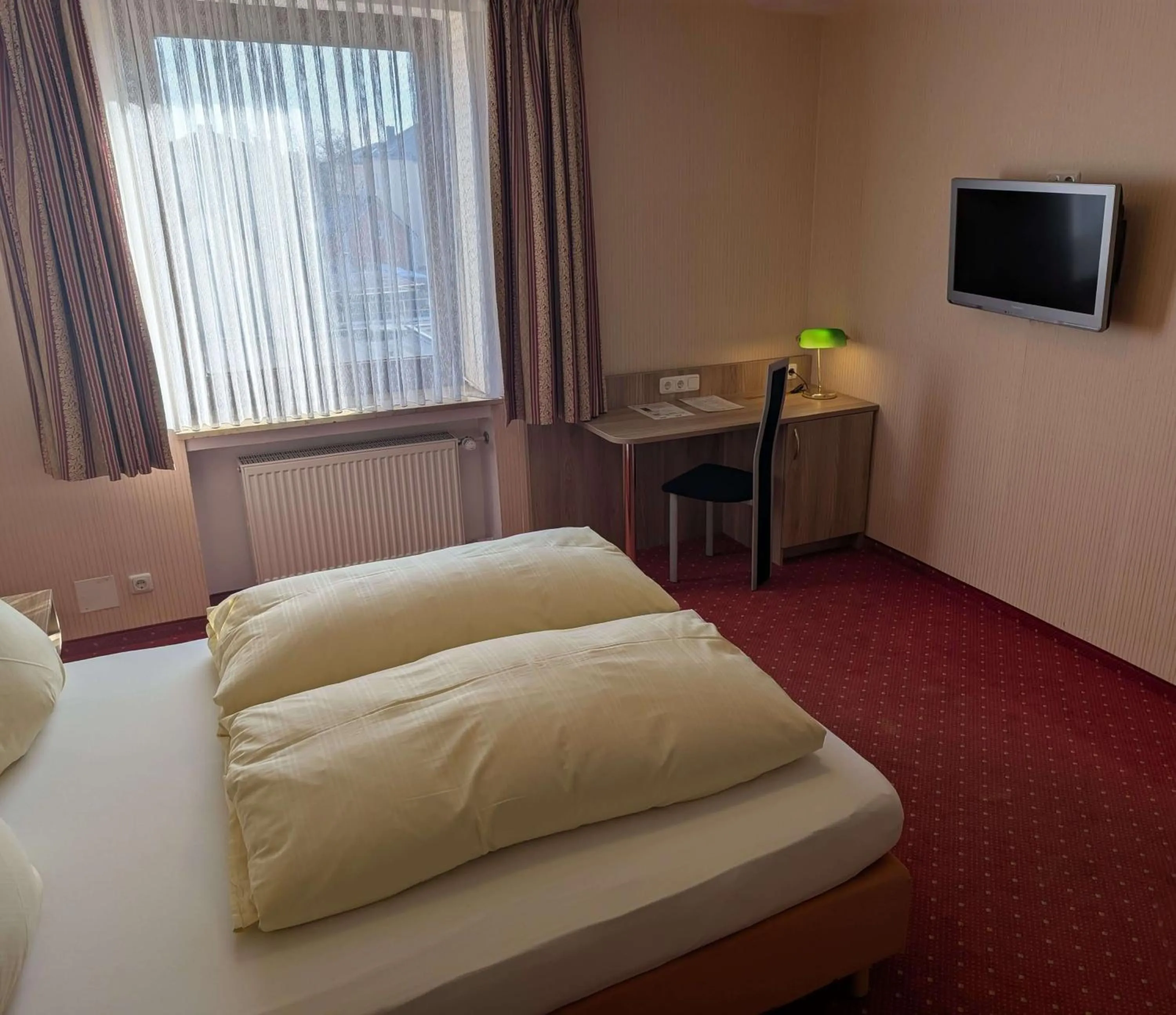 Bed in Stadthotel Augsburg