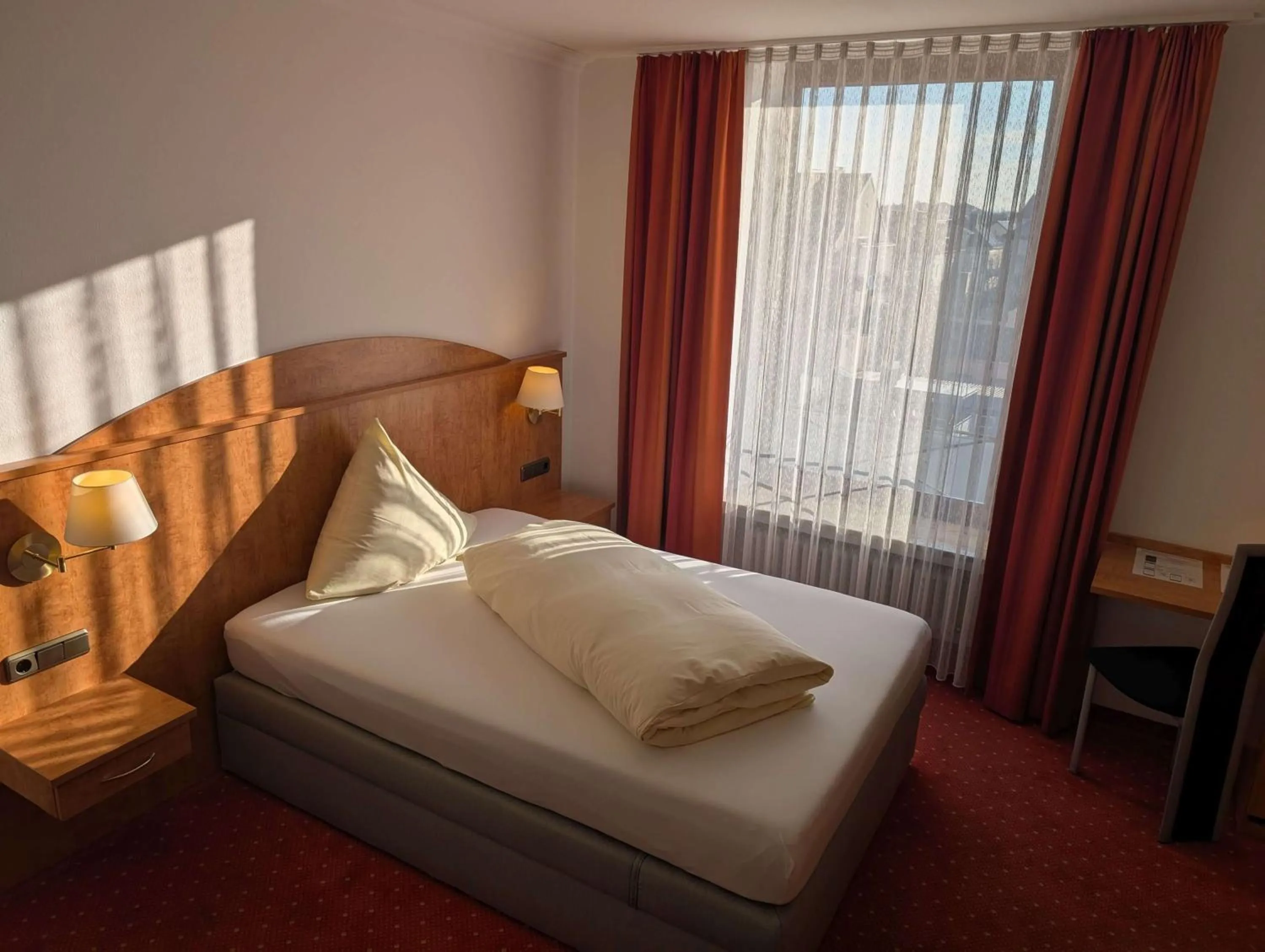 Bed in Stadthotel Augsburg