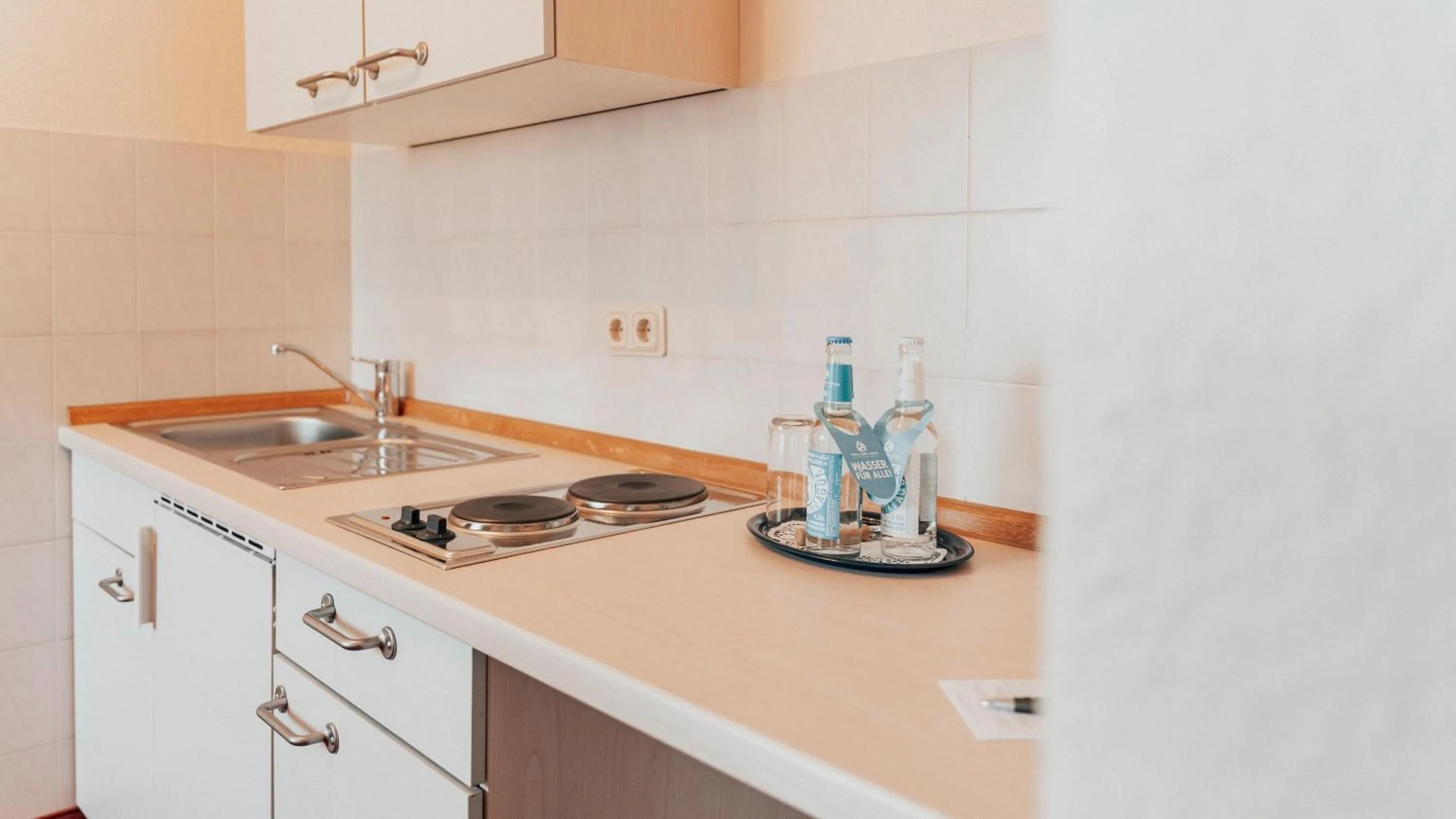 Kitchen or kitchenette in Avantgarde Hotel