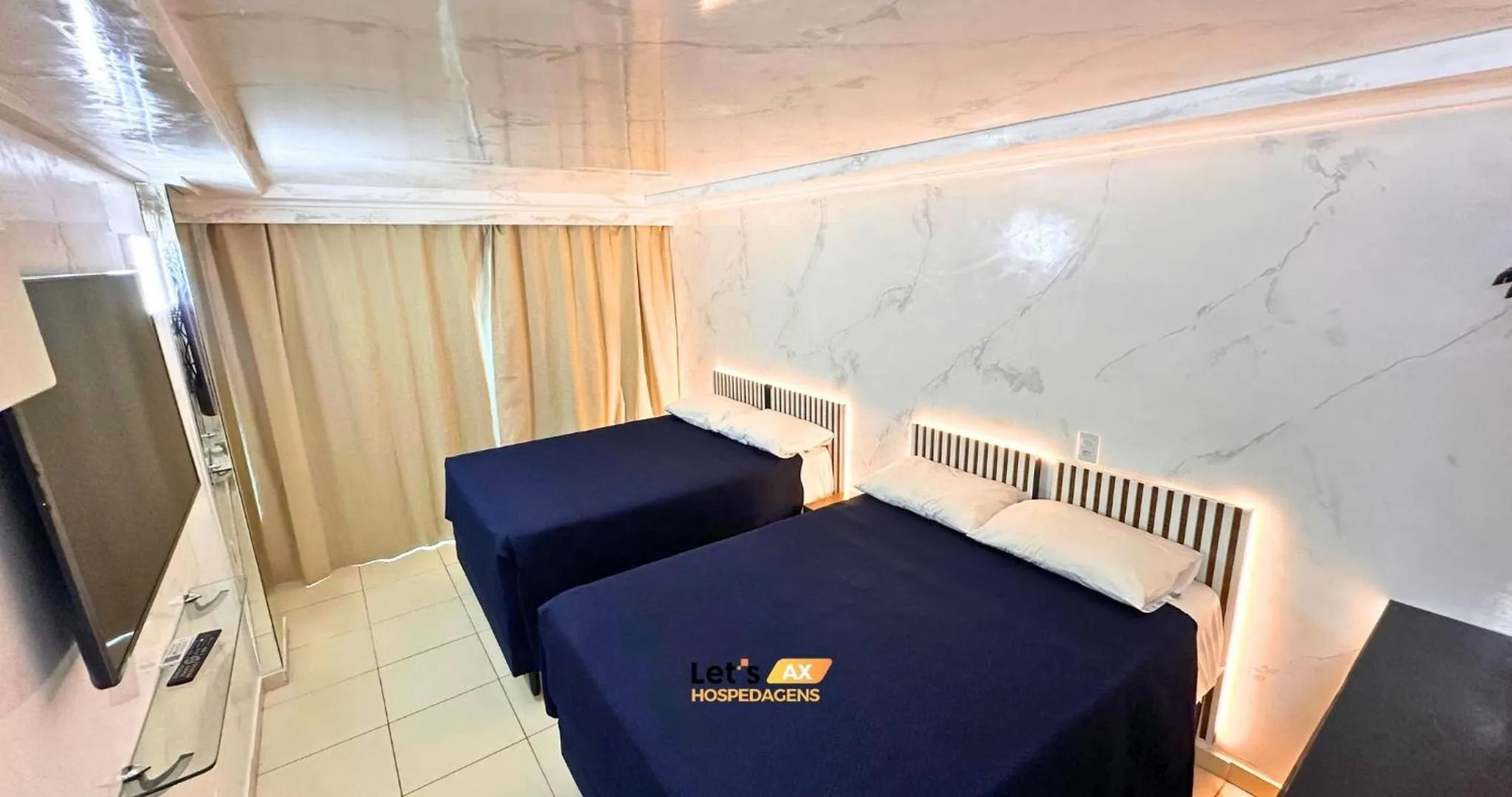 Bed in AX Blue Suítes