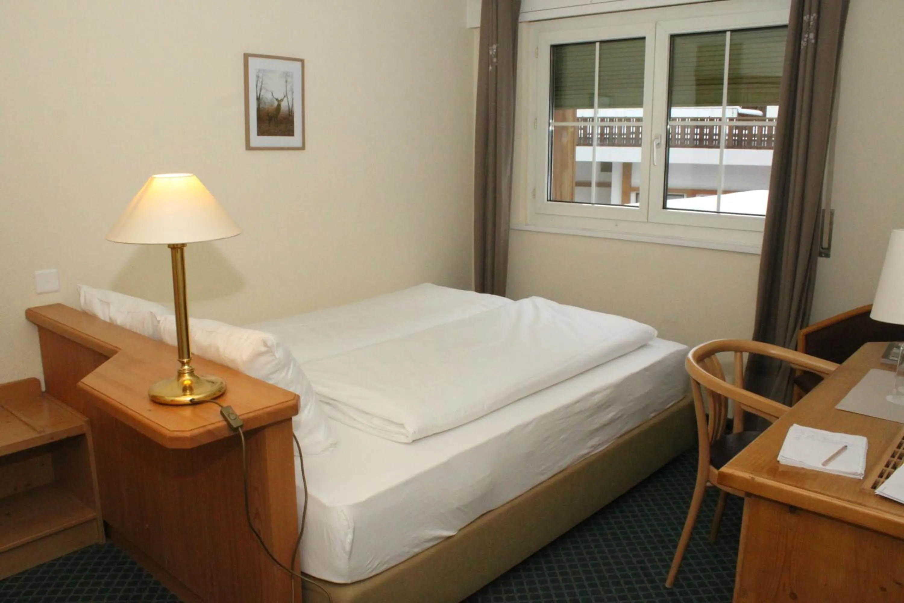 Bed in Grichting Hotel & Serviced Apartments