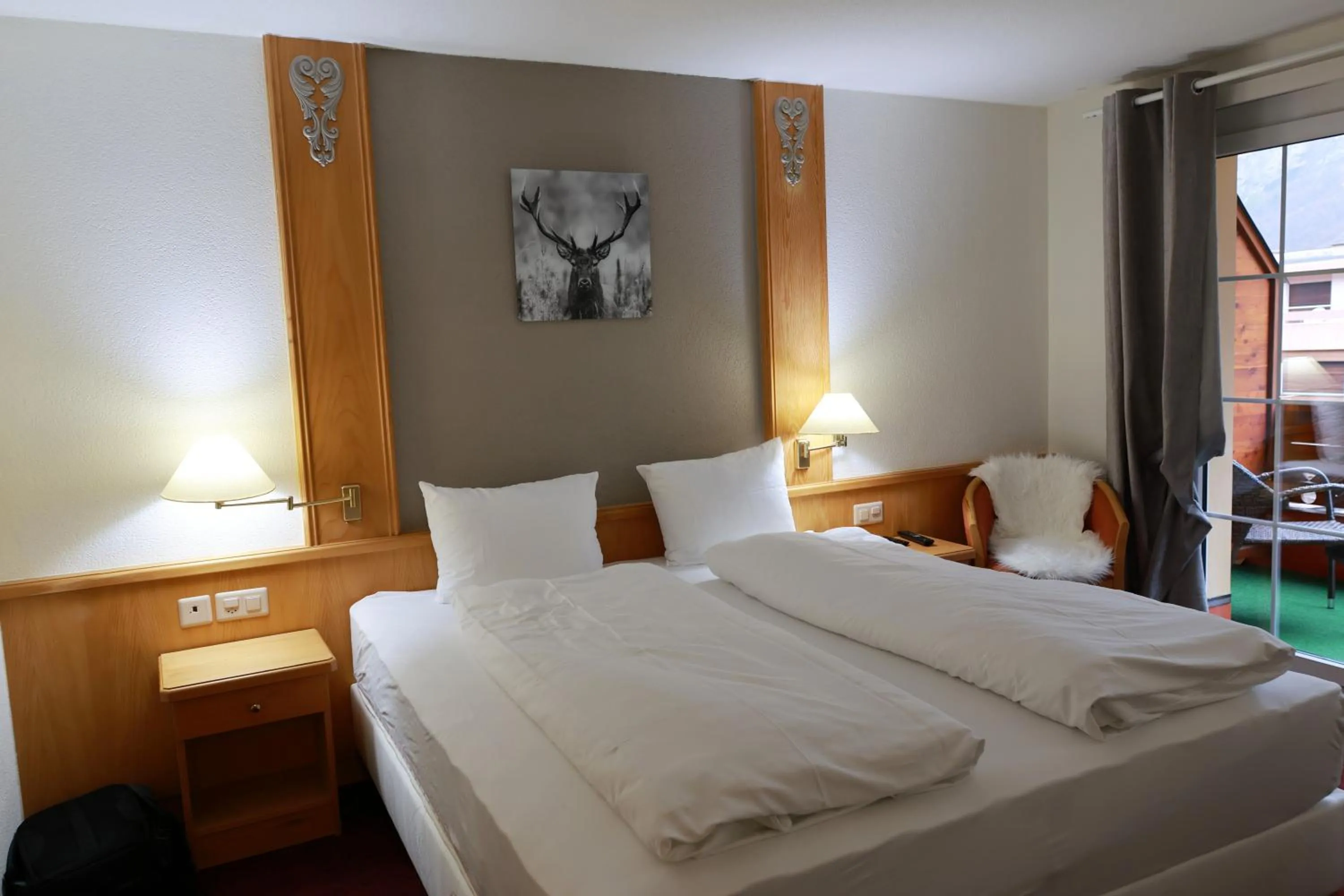 Bed in Grichting Hotel & Serviced Apartments