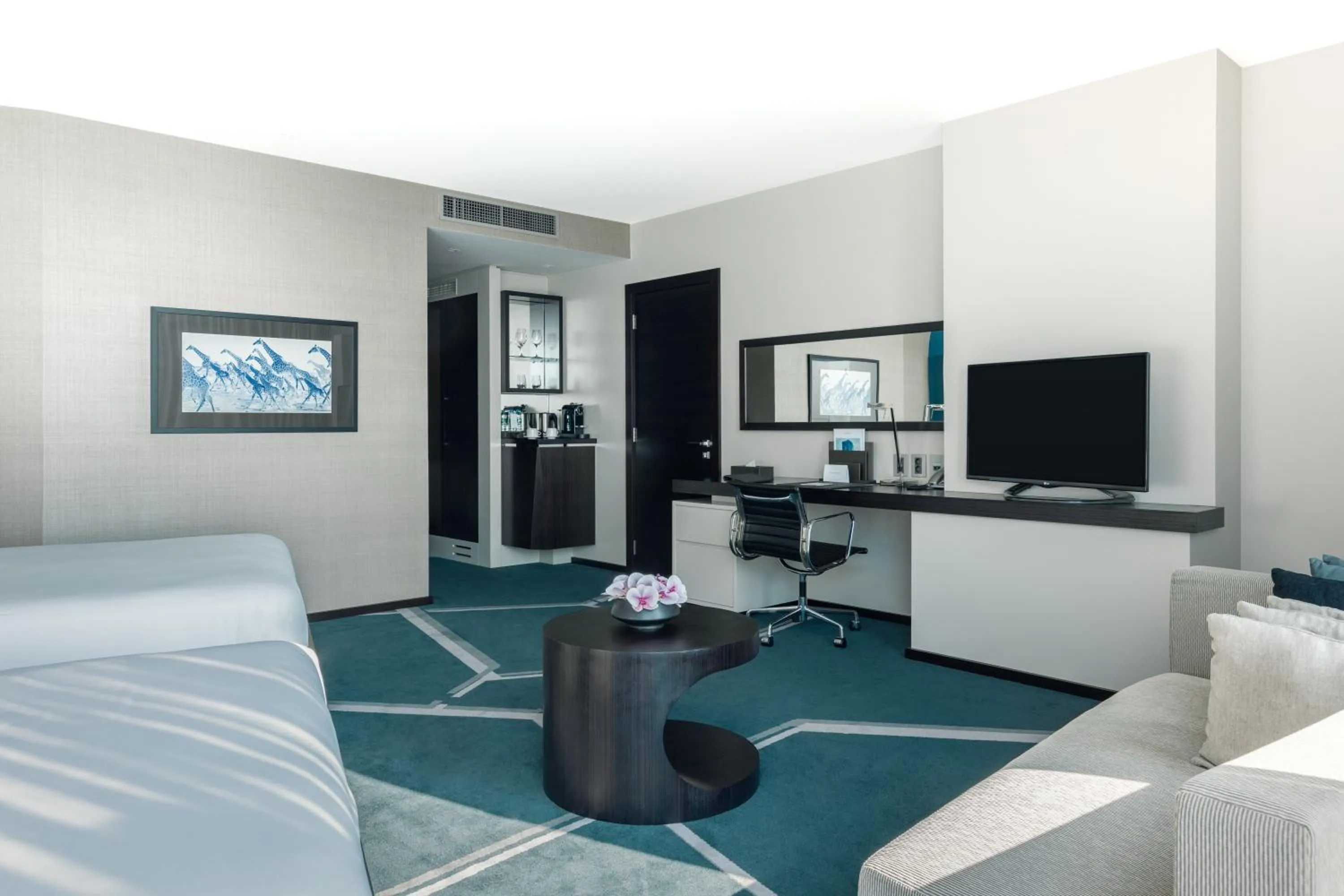 Communal lounge/ TV room in InterContinental Luanda Miramar by IHG