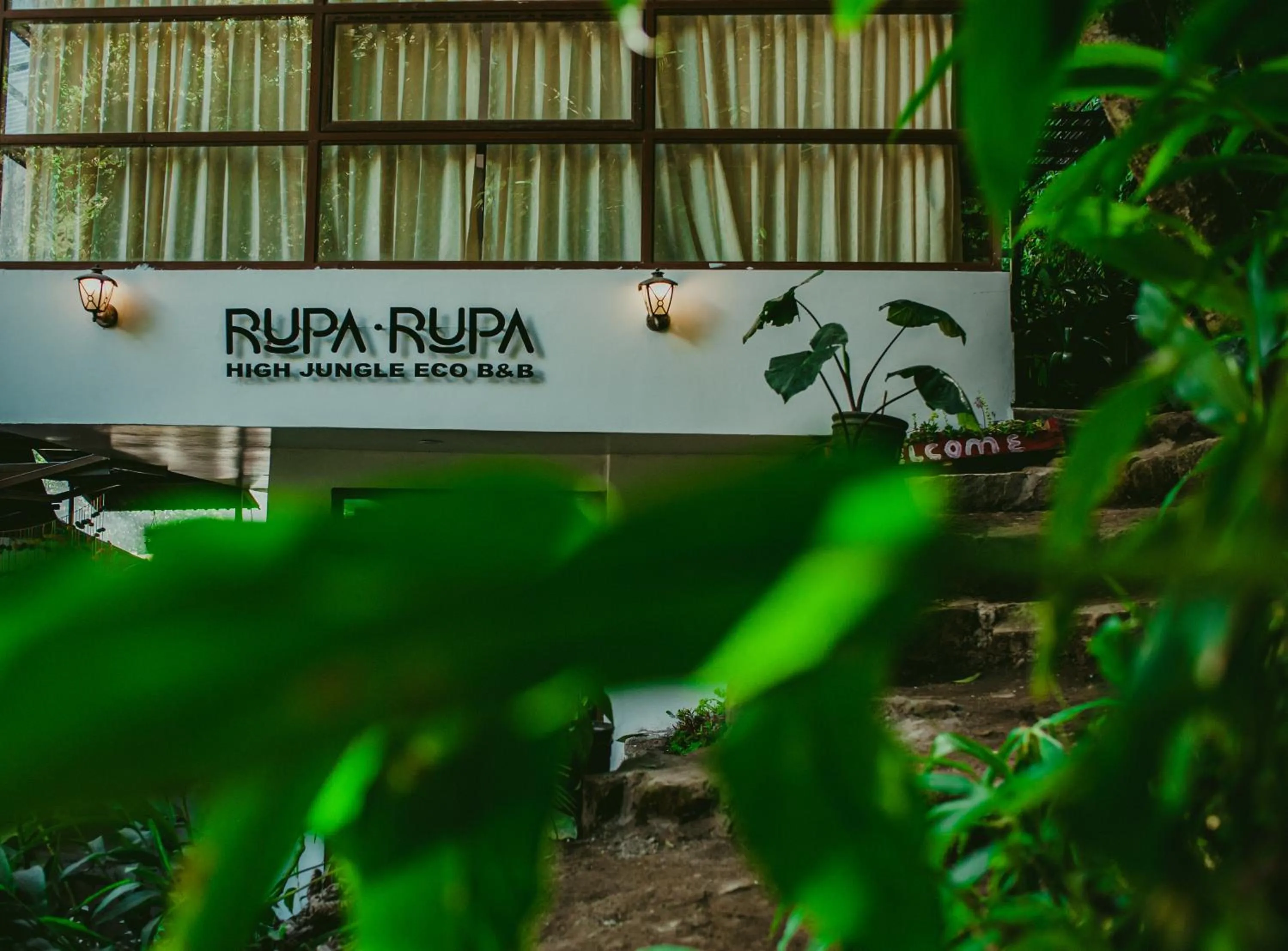 Property logo or sign in Rupa Rupa High Jungle Eco B&B