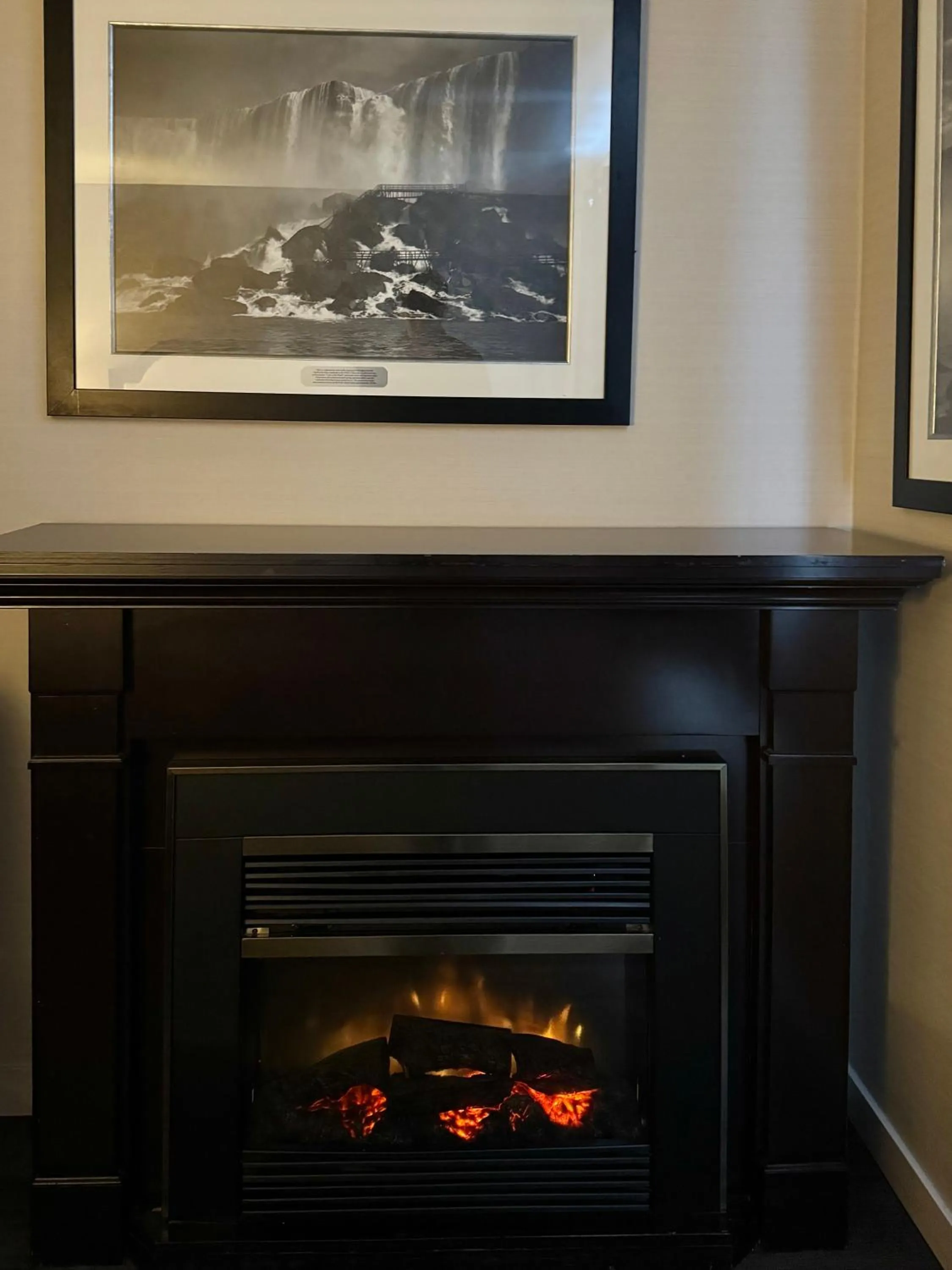 fireplace in Big Bird Inn Wawa, SureStay Collection by Best Western