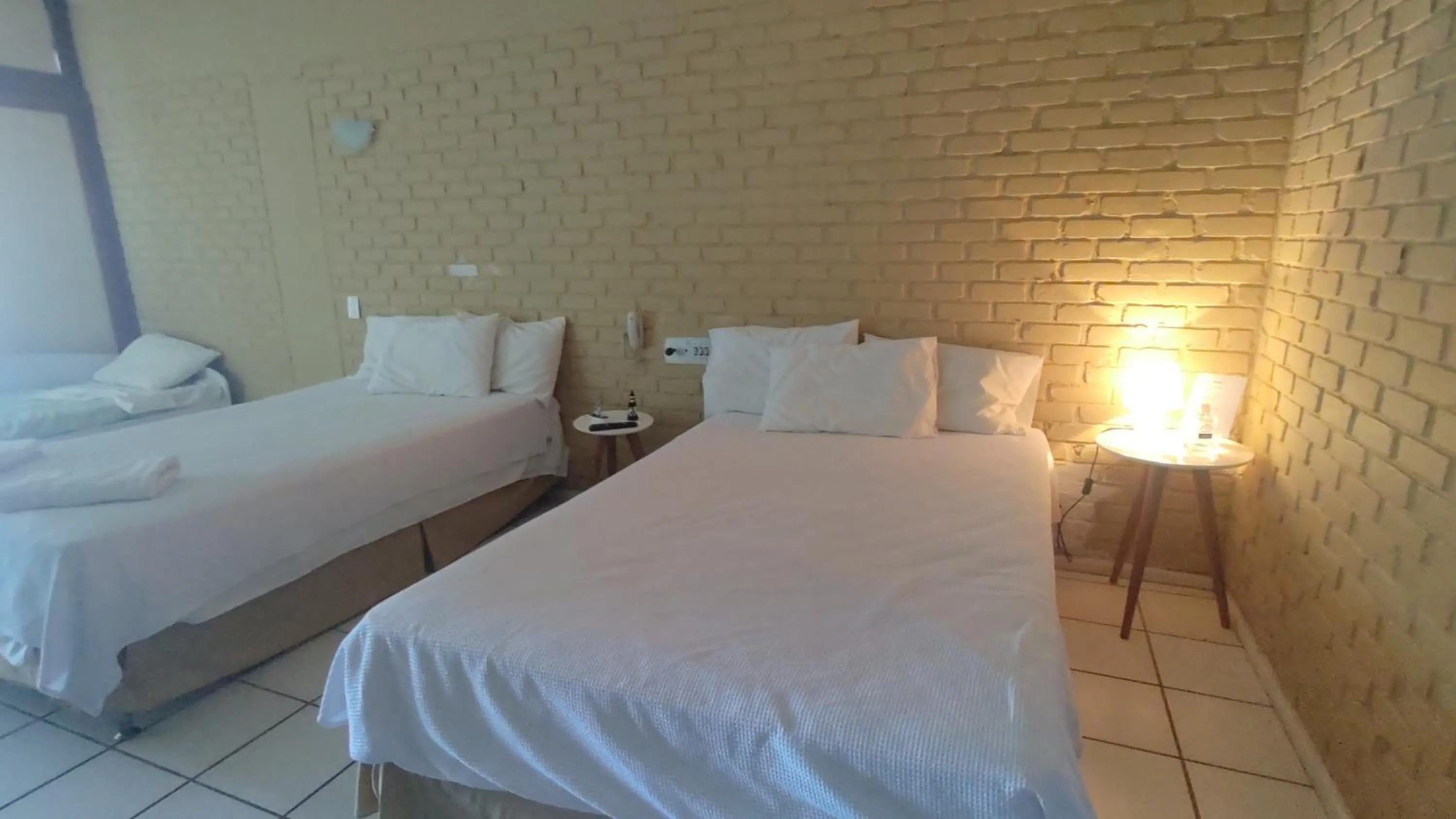 Bed in Angra dos Reis Flat Suíte no Portogalo