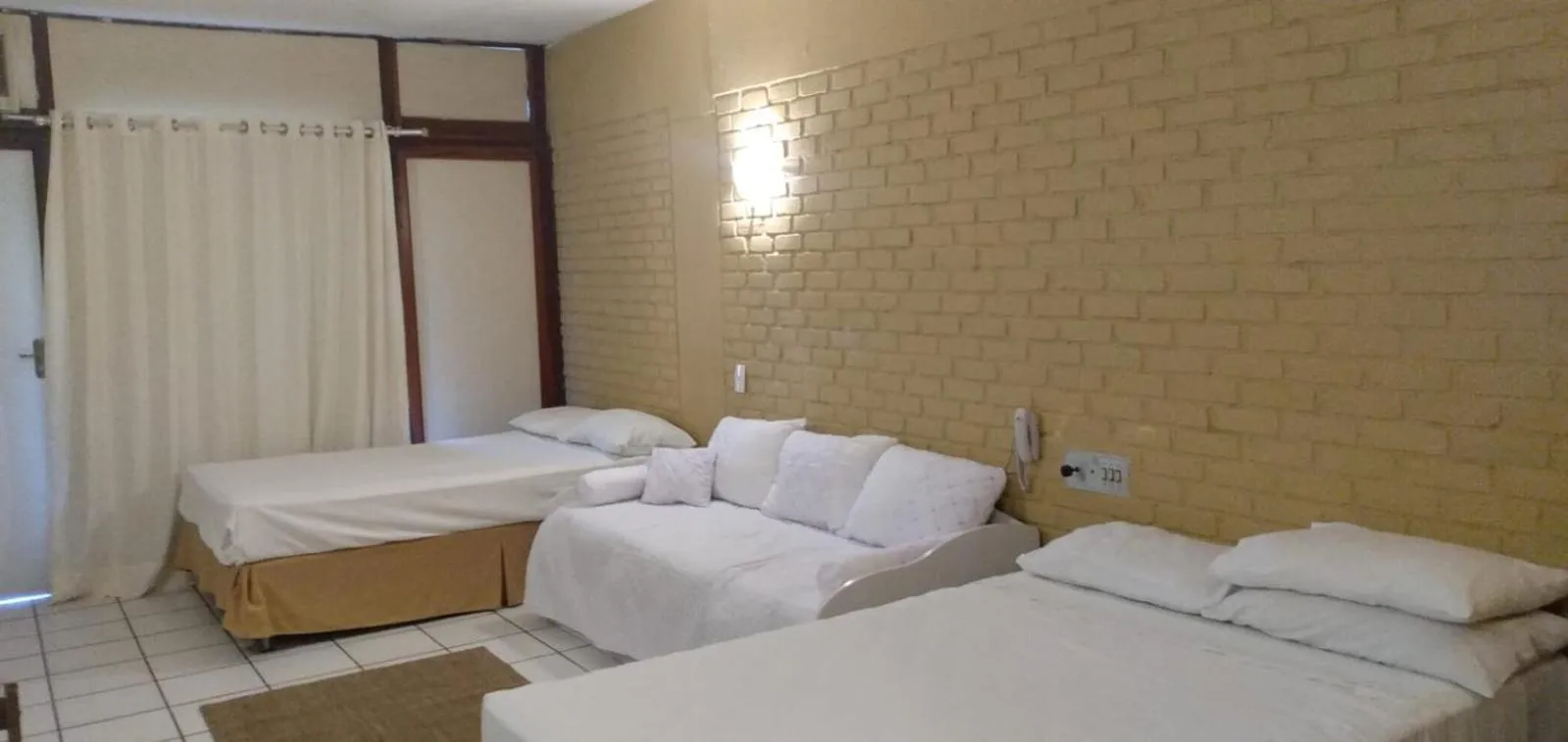 Bed in Angra dos Reis Flat Suíte no Portogalo