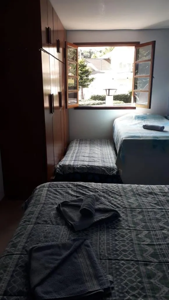 Bed in Colinas Capivari Suites