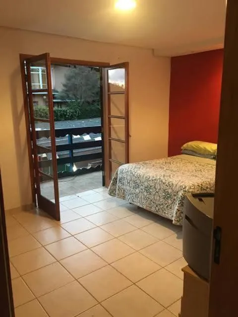 Bed in Colinas Capivari Suites