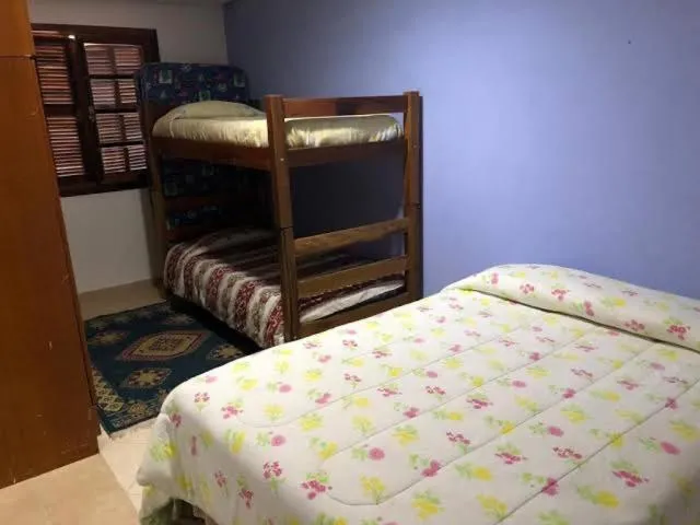 Bed in Colinas Capivari Suites