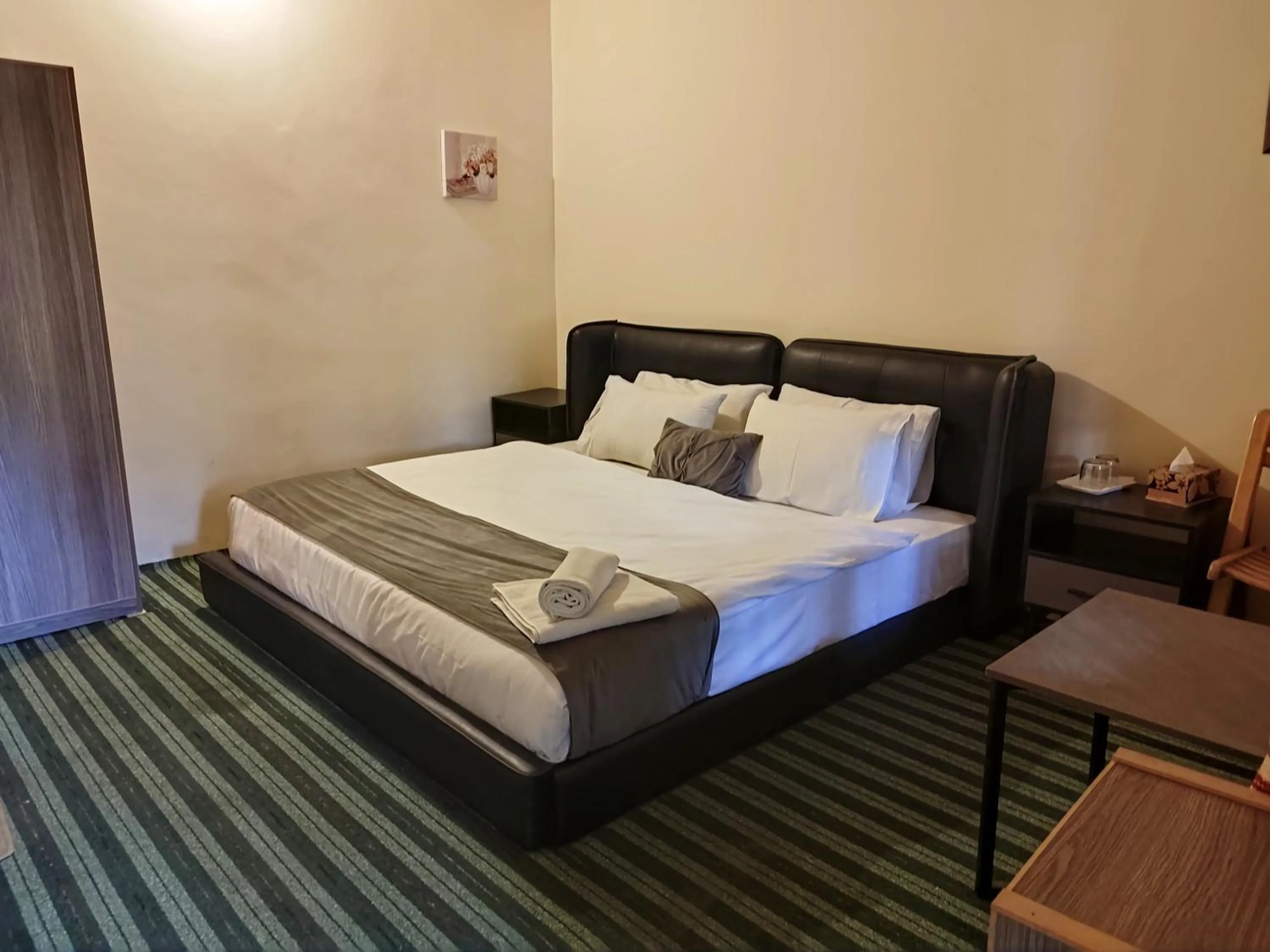 Bed in Grapes Garden Resort Hunza