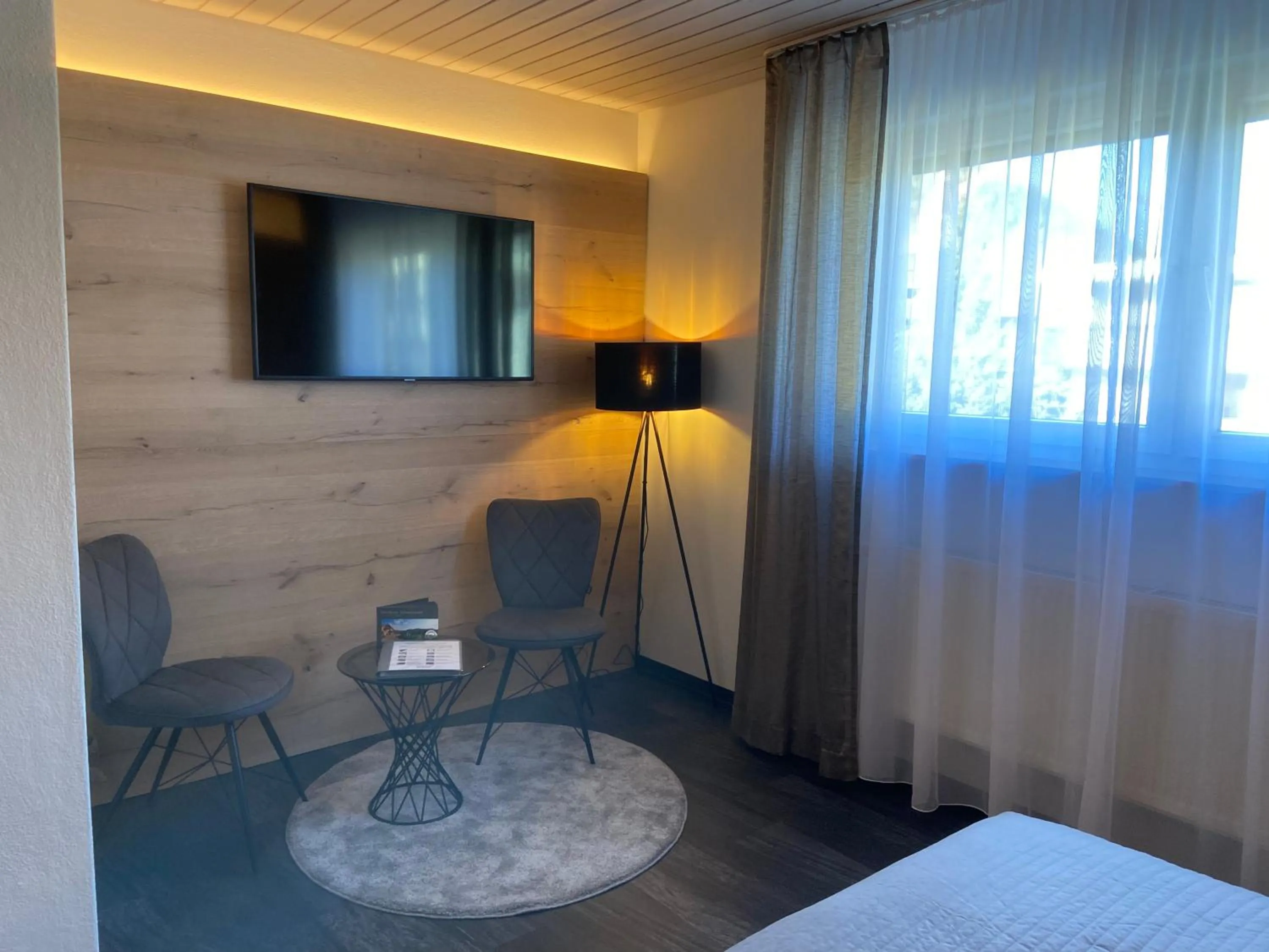 Seating area, Bed in Hotel Koch