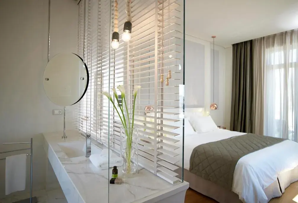 Bathroom, Bed in Marpessa Hotel & Spa Bathroom, Bed in Marpessa Hotel & Spa