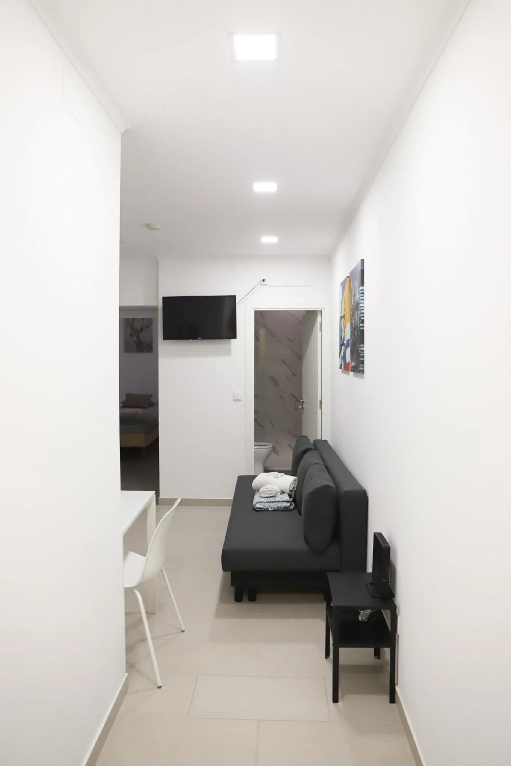 Communal lounge/ TV room, Bed in Oriente DNA Studios V