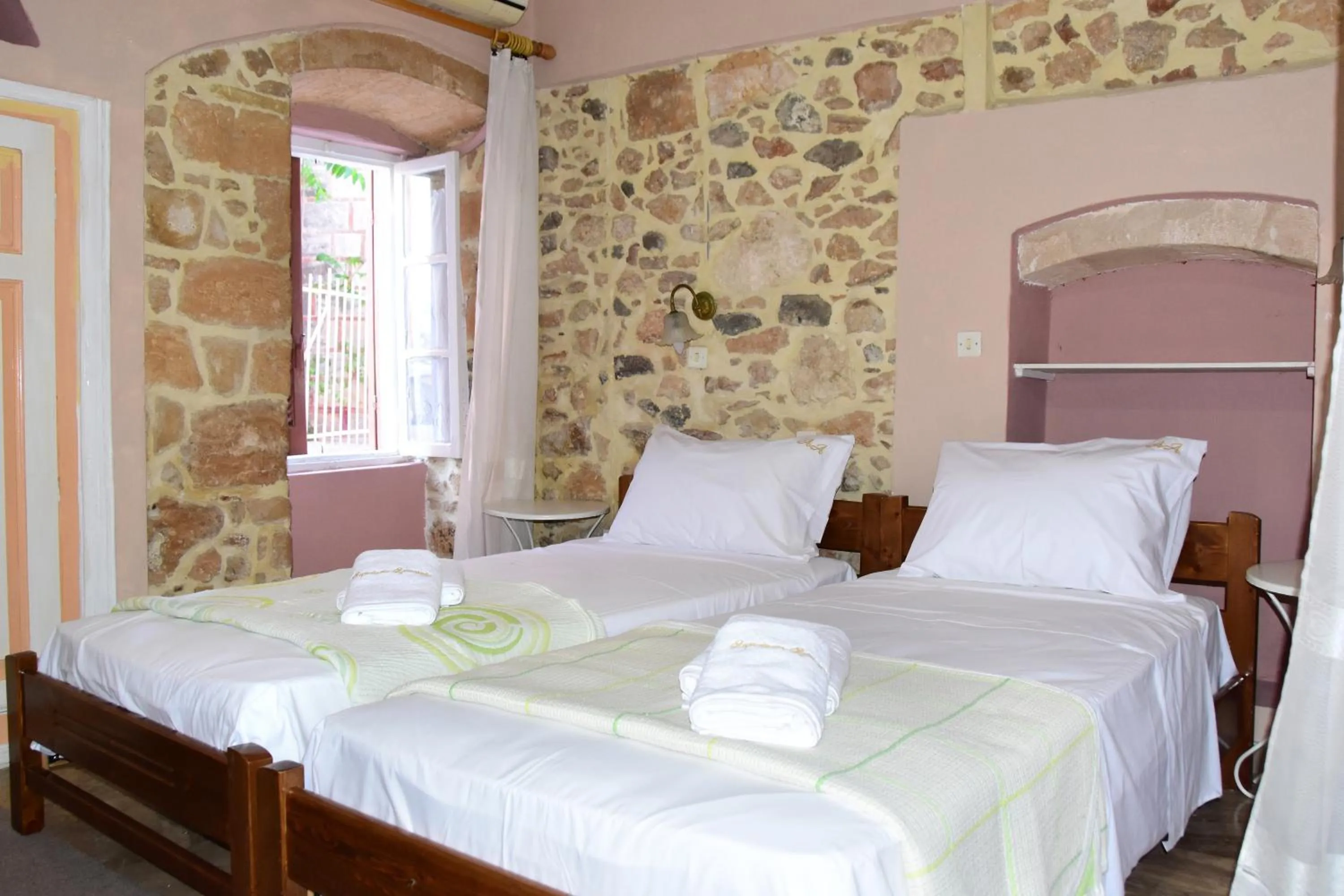 Bed in Aeginitikon Arhontikon Stylish Boutique Hotel