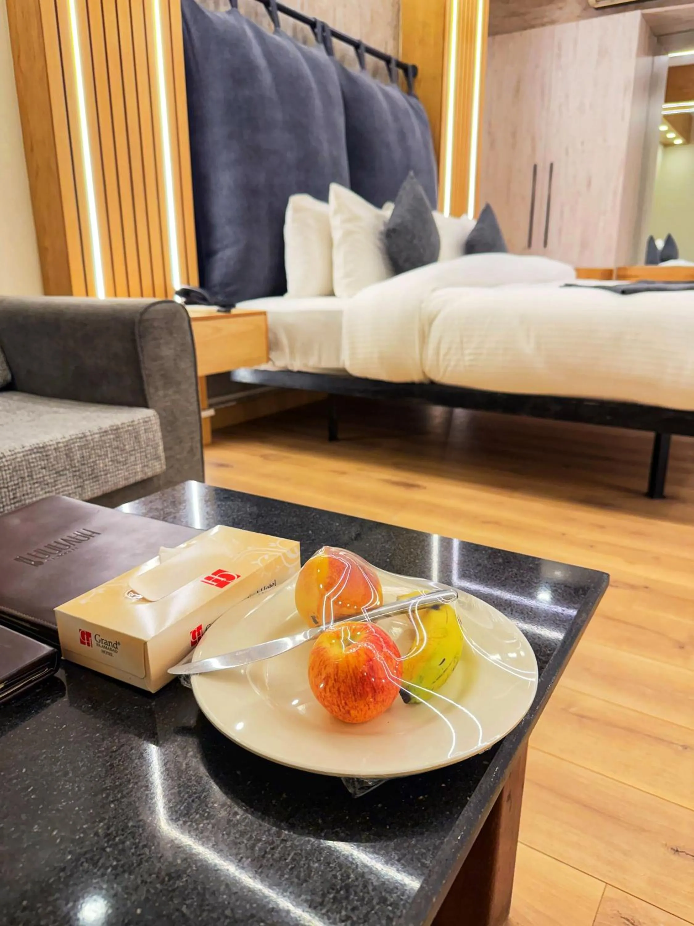 Bed in Grand Islamabad Hotel