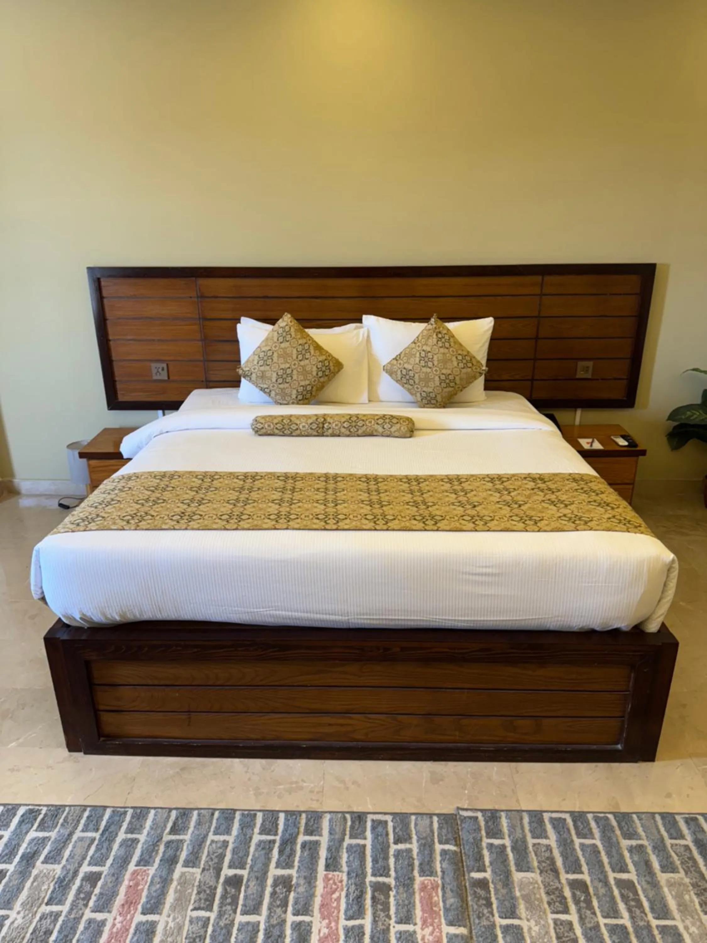 Bed in Grand Islamabad Hotel