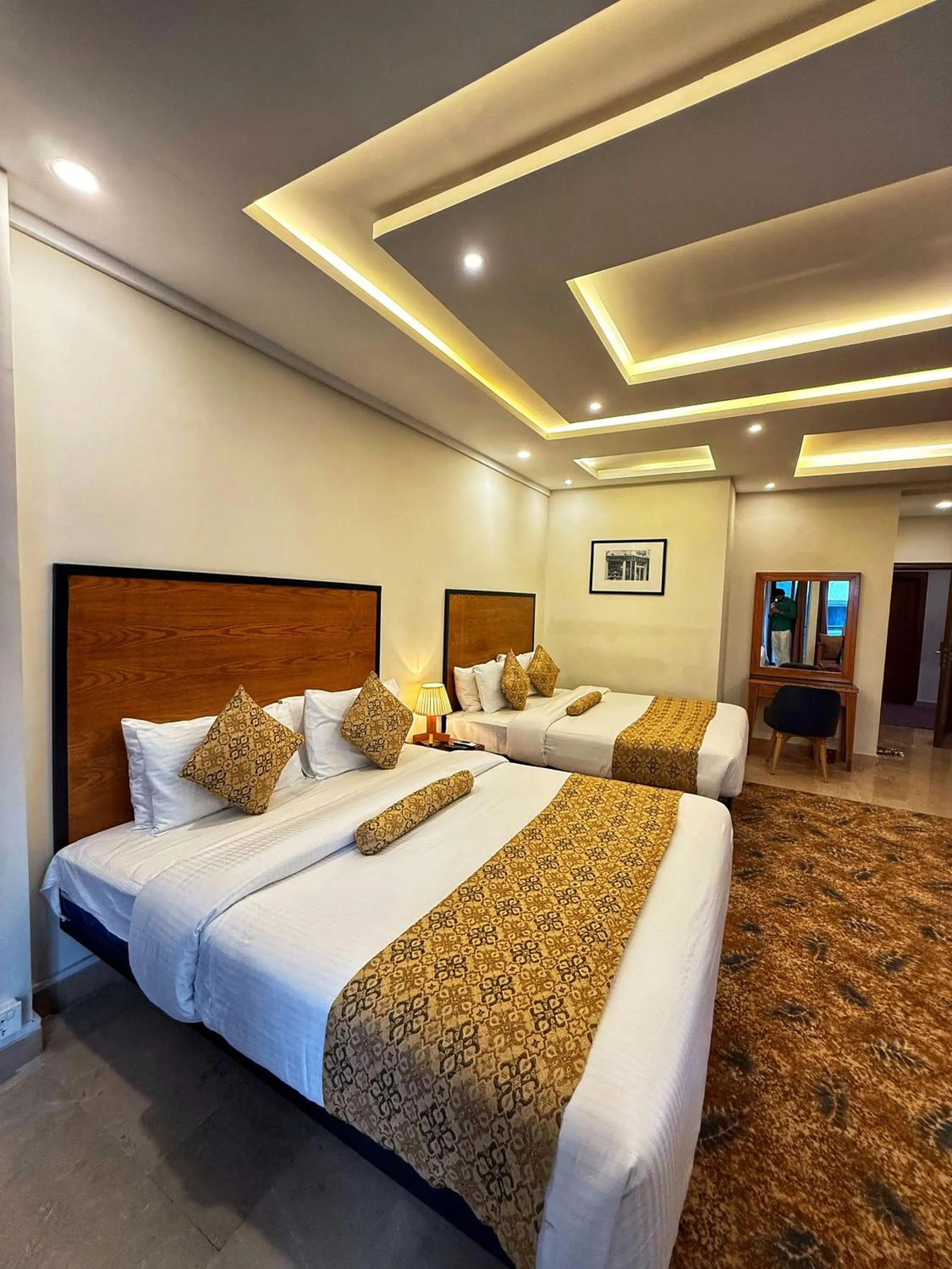 Bed in Grand Islamabad Hotel