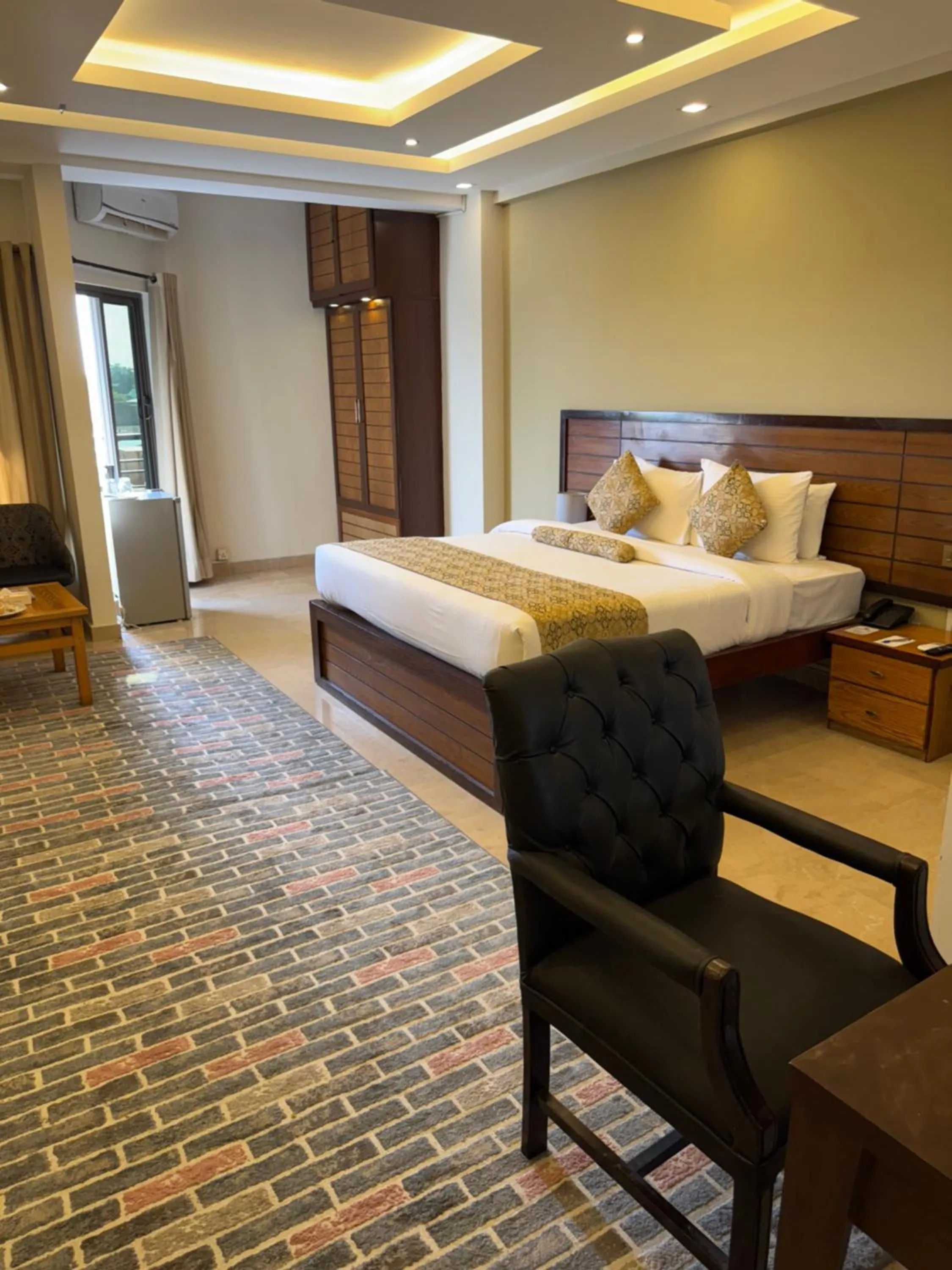 Bed in Grand Islamabad Hotel