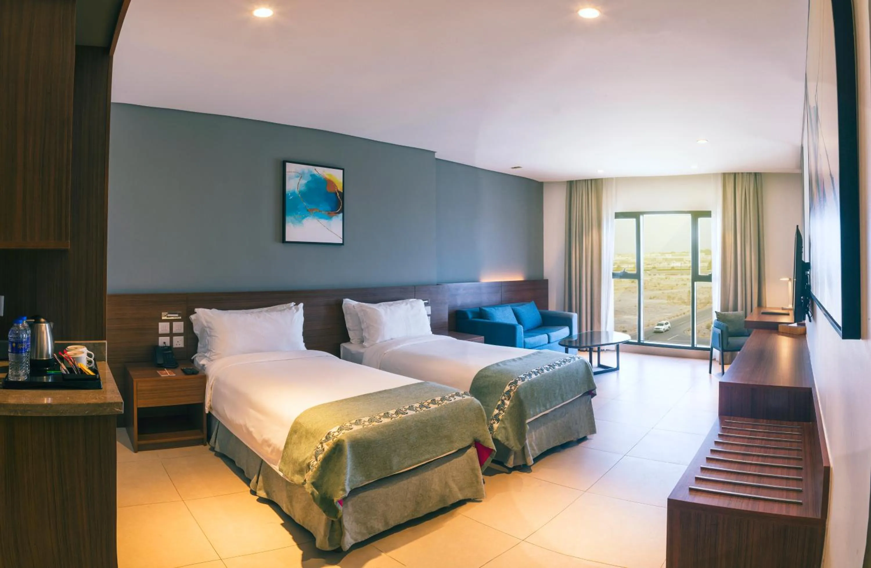 Living room, Bed in Boulevard Hotel Oman