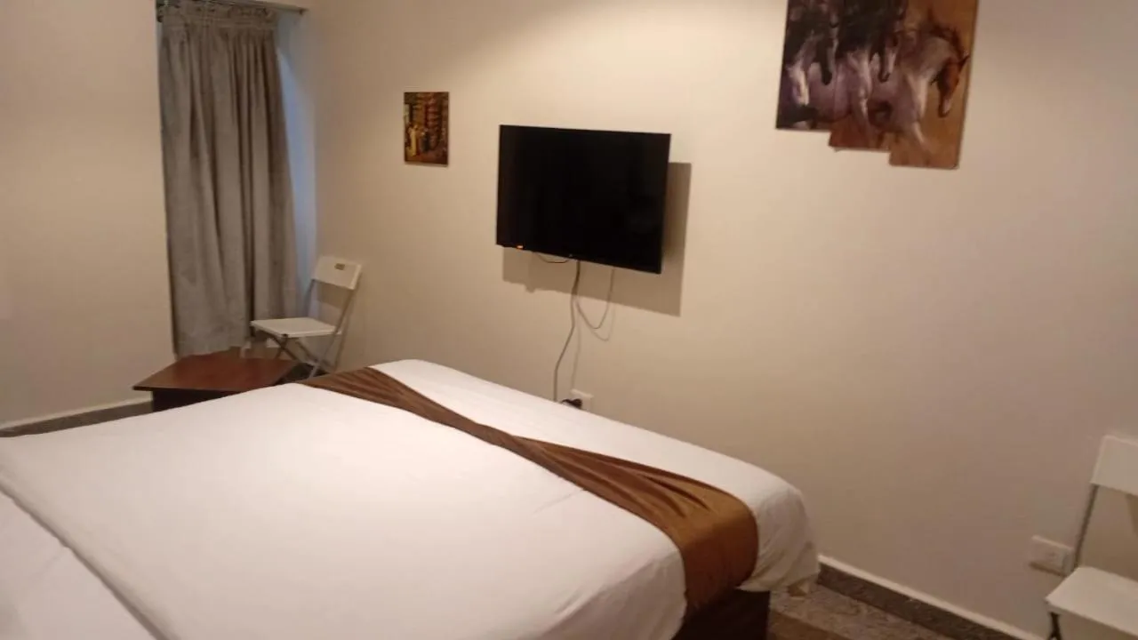 Bed in Royal Inn Residence