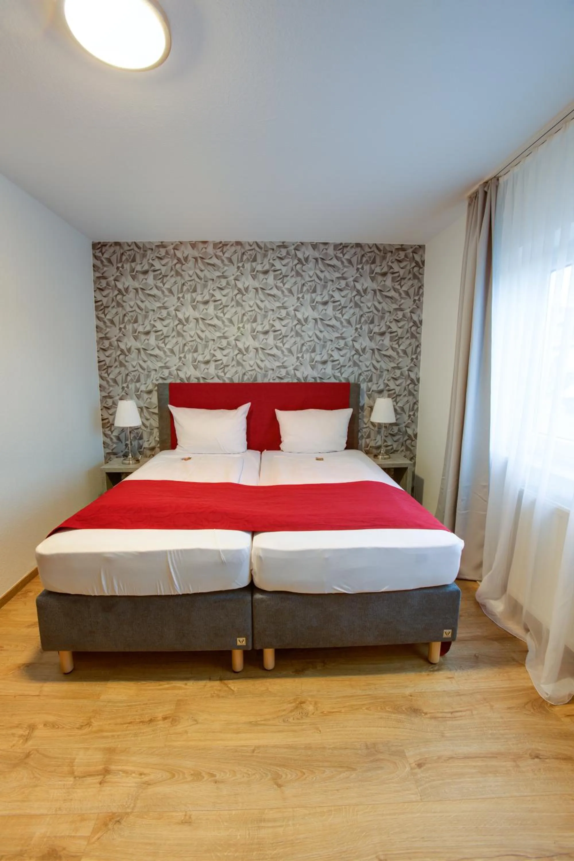 Bed in Hotel Leo Mühlhausen