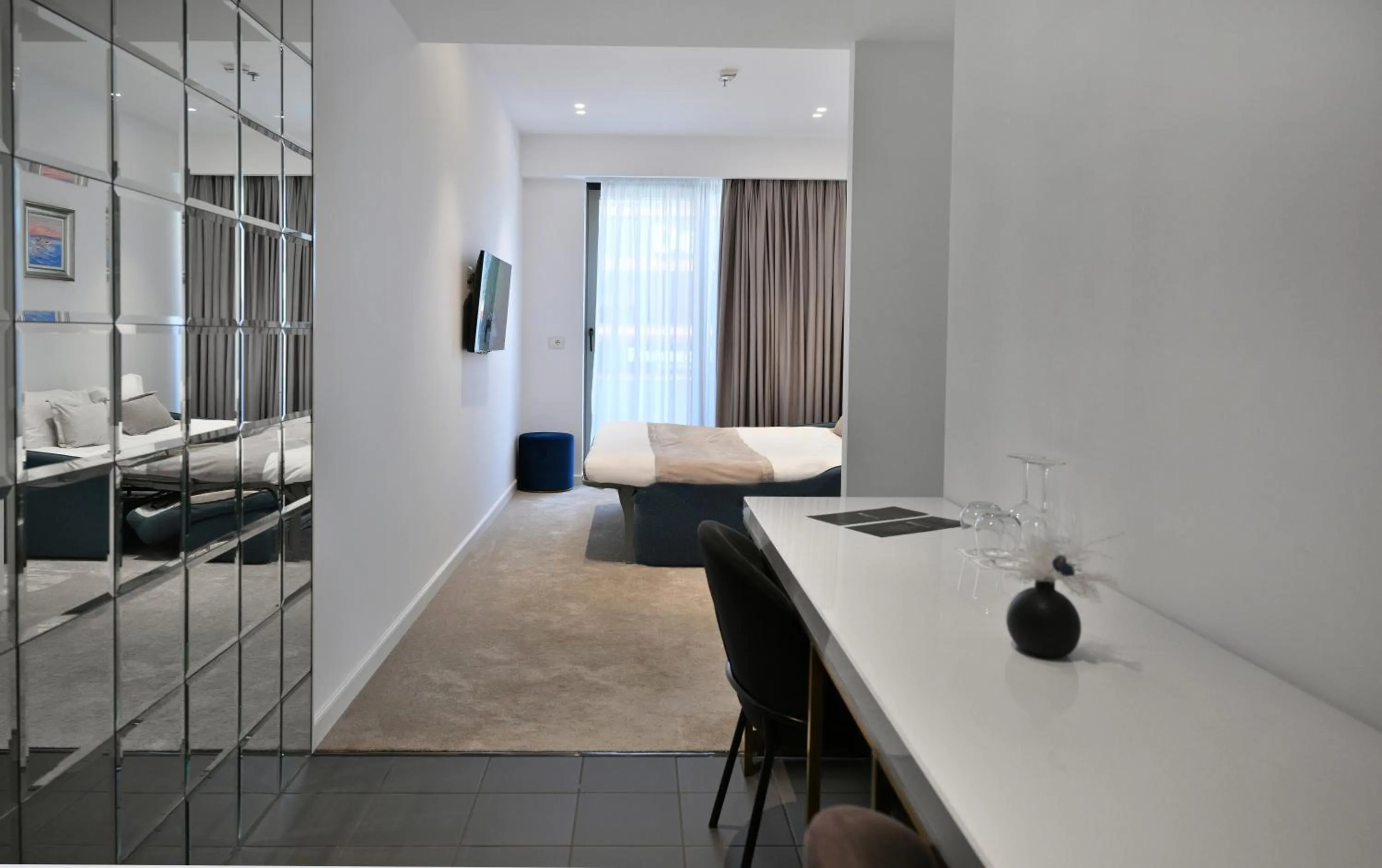 Communal lounge/ TV room, Bed in Habitat Hotel Tirana