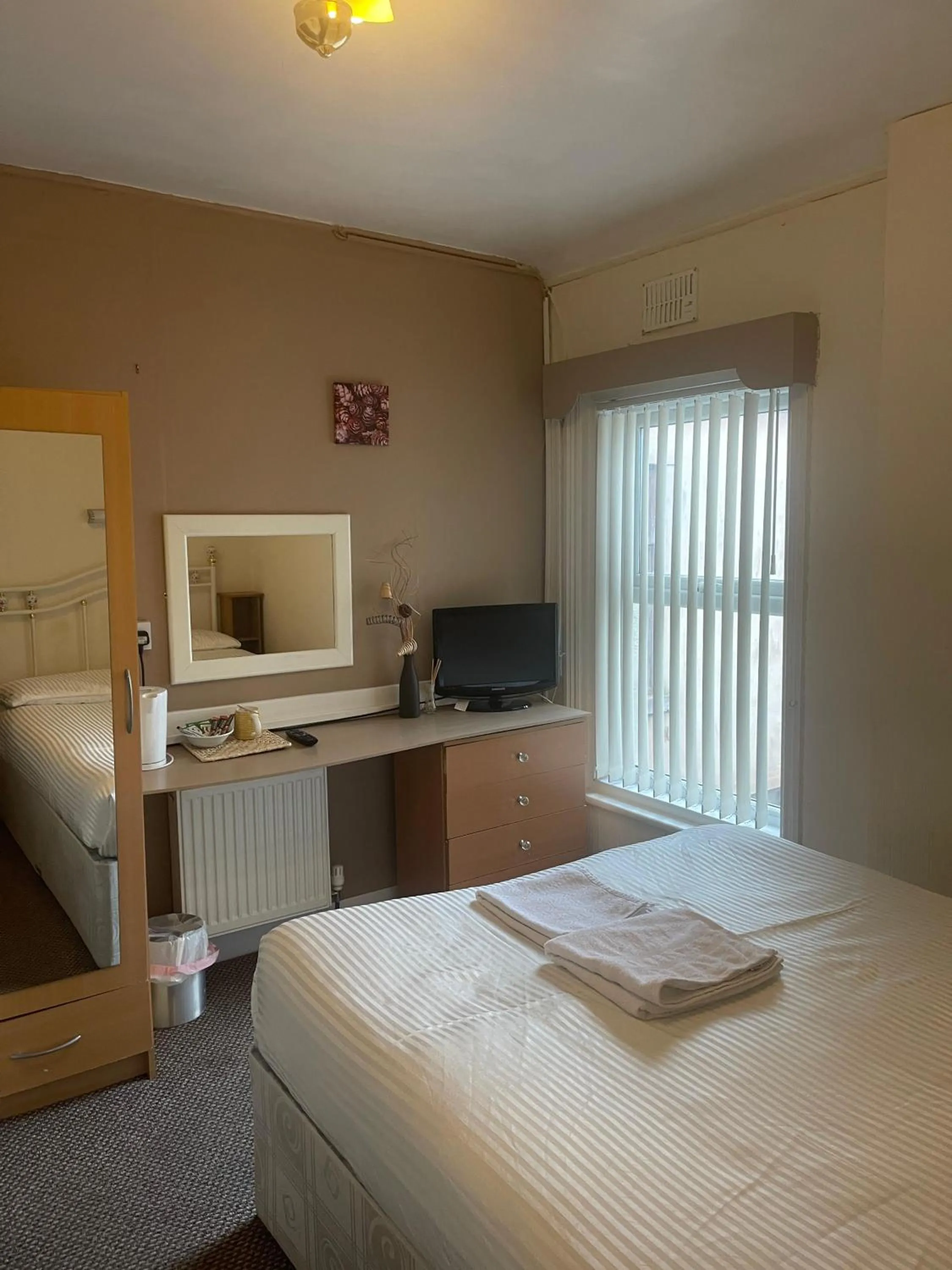 Bed in White Moon Hotel