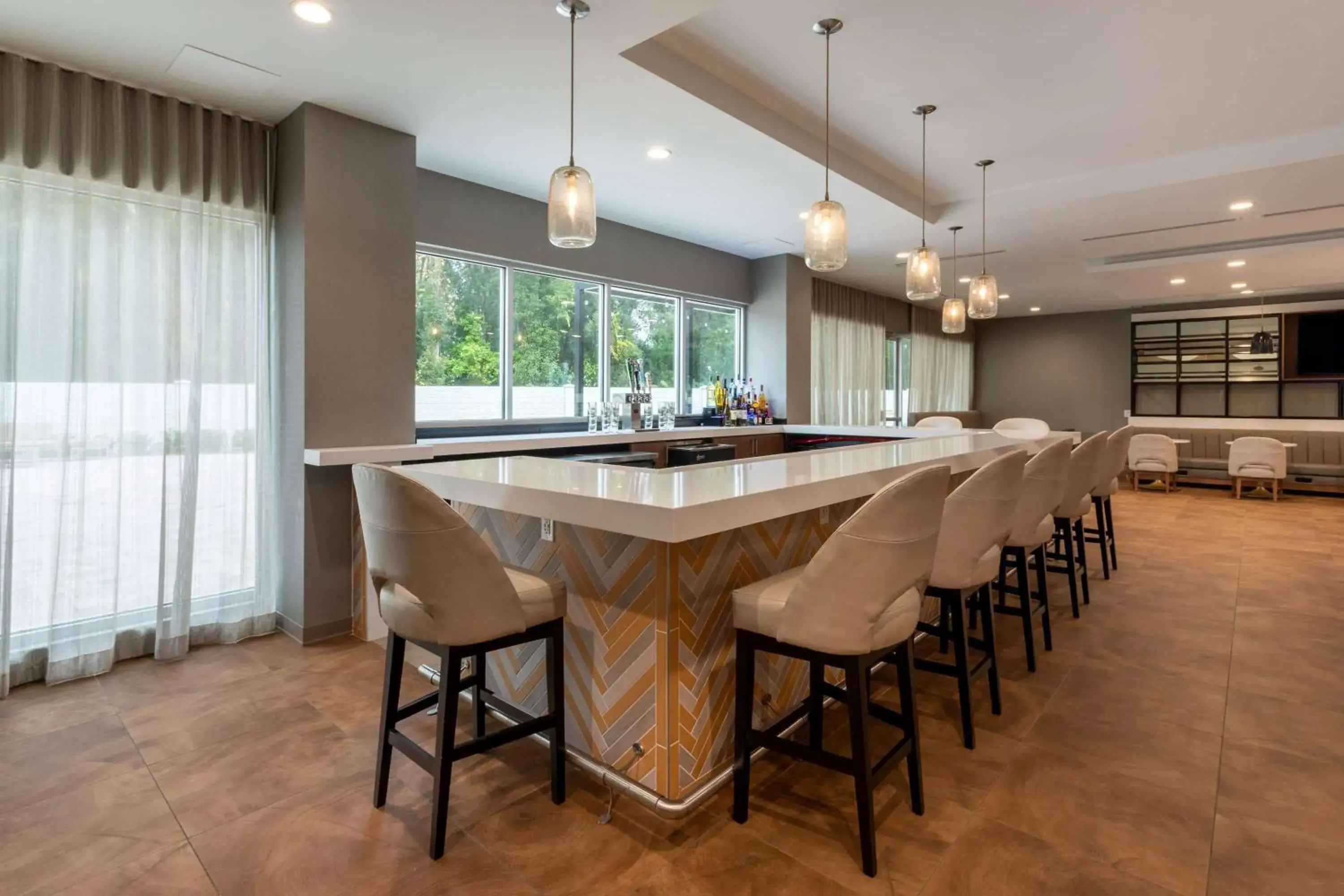 Lounge or bar in Wyndham Garden Orlando Airport - Free Airport Shuttle Lounge or bar in Wyndham Garden Orlando Airport - Free Airport Shuttle