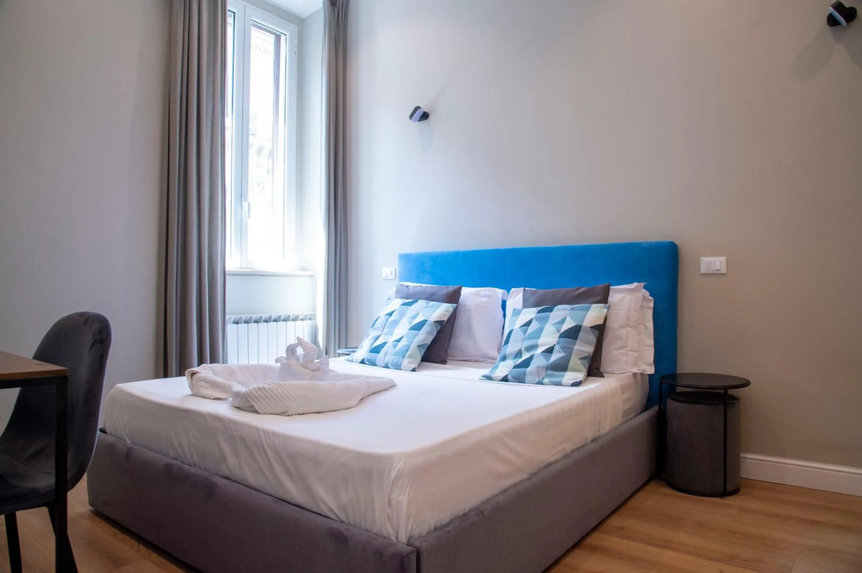 Bed in AD Suites Tritone