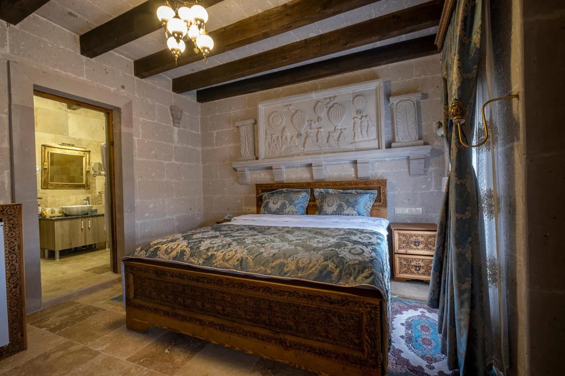 Bed in Underground Cave Suites Hotel