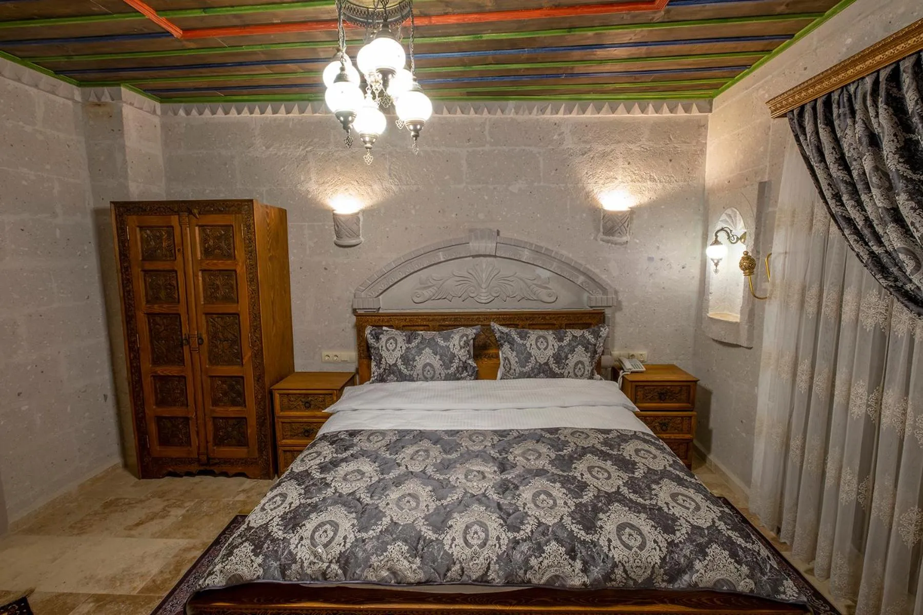 Bed in Underground Cave Suites Hotel