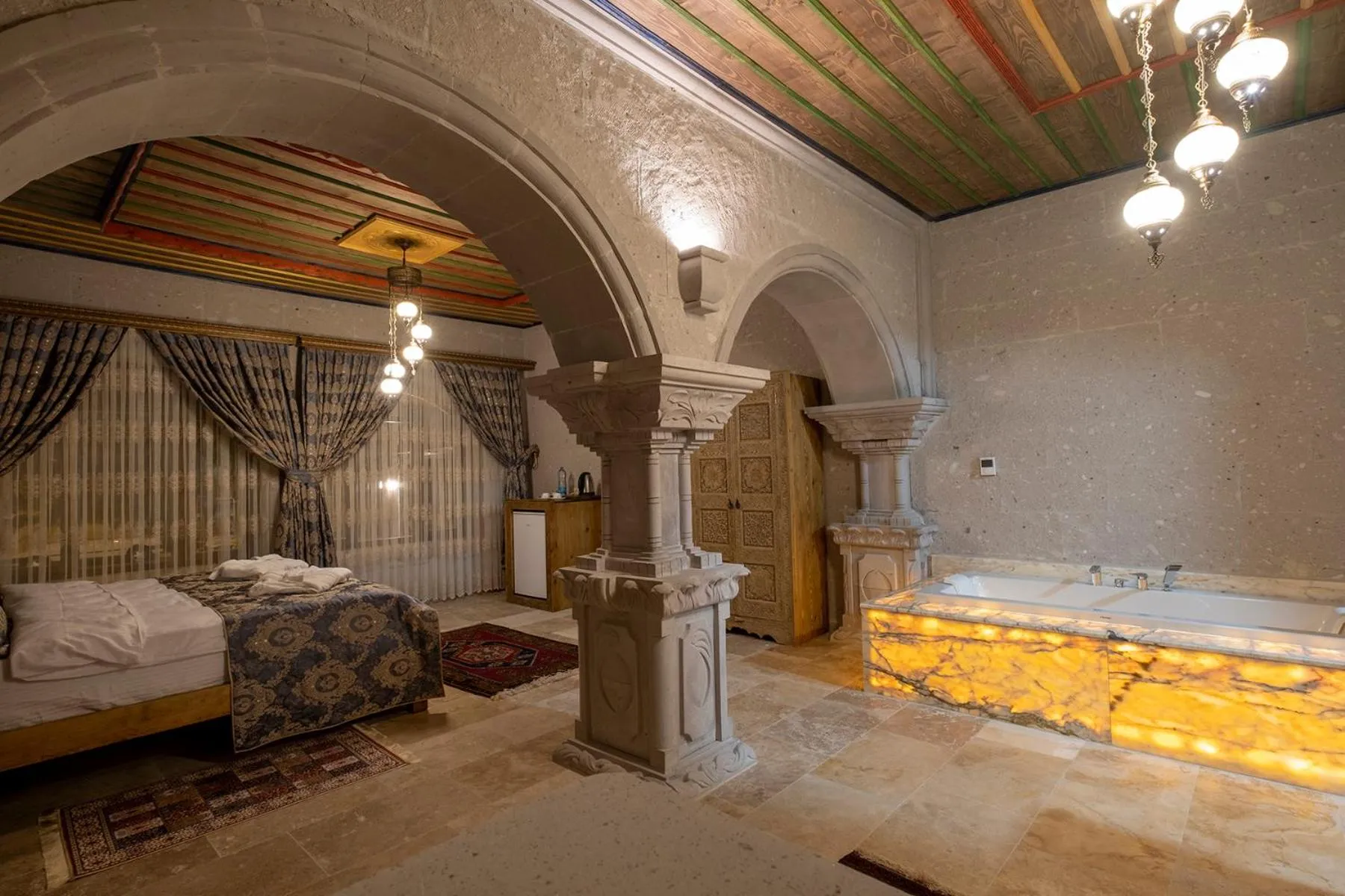 TV and multimedia, Bed in Underground Cave Suites Hotel