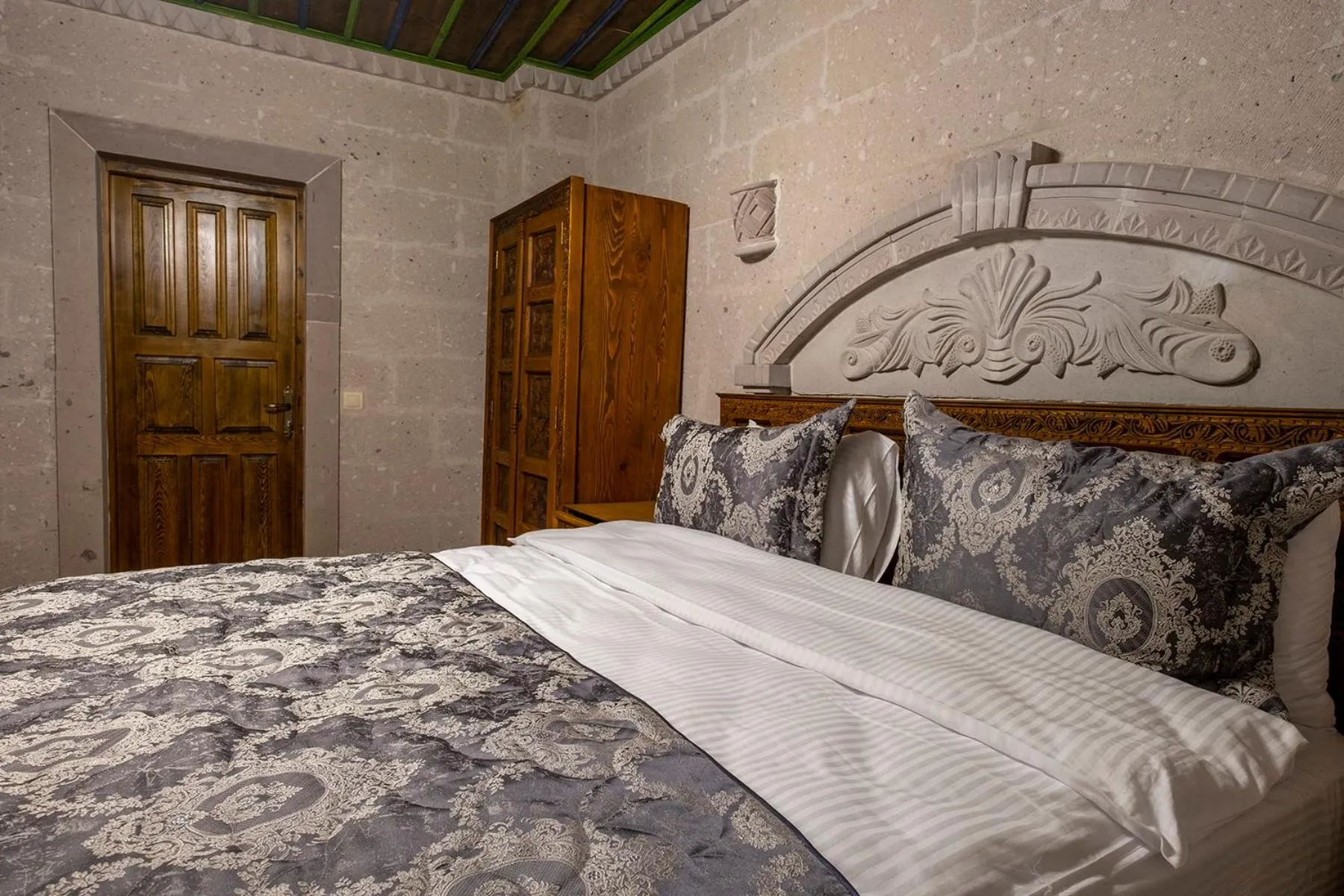 Bed in Underground Cave Suites Hotel