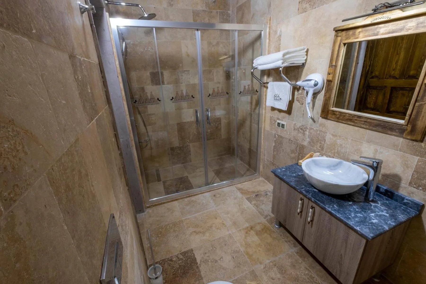 Shower in Underground Cave Suites Hotel
